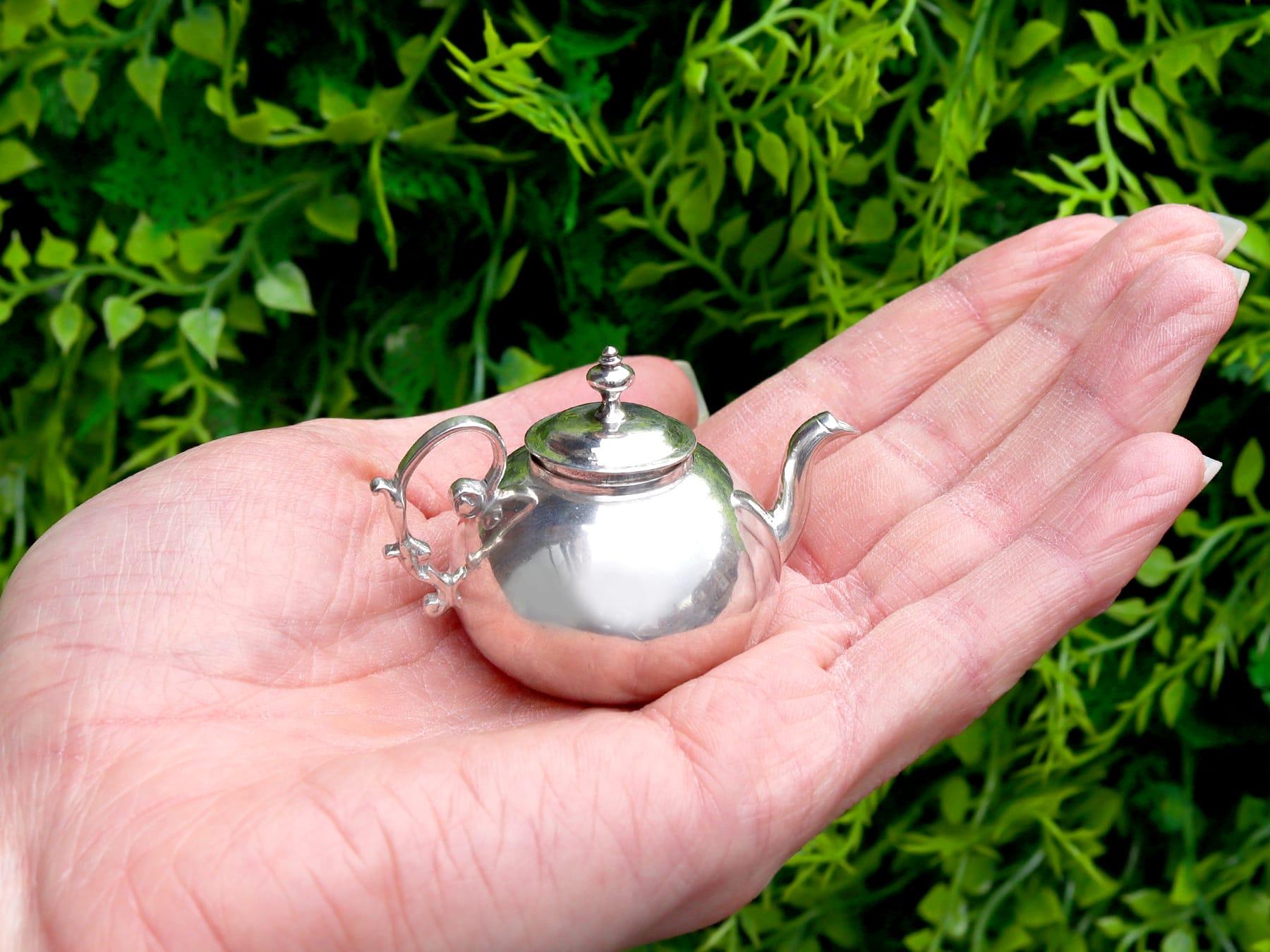 An exceptional, fine and impressive, antique 18th century Dutch silver miniature teapot; an addition to our silver teaware collection

This exceptional, fine and impressive antique 18th century Dutch silver miniature teapot has a circular rounded