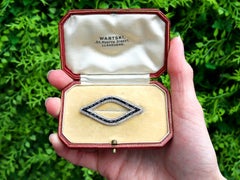 Cartier 1.70 Carat Black Onyx 2.20 Carat Diamond Platinum Brooch Circa 1925