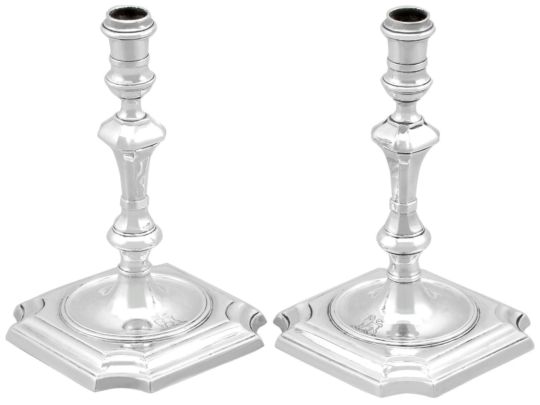 An exceptional, fine and impressive pair of antique George I English cast sterling silver tapersticks; an addition of our ornamental Georgian silverware collection

These exceptional antique George I cast sterling silver tapersticks have a plain