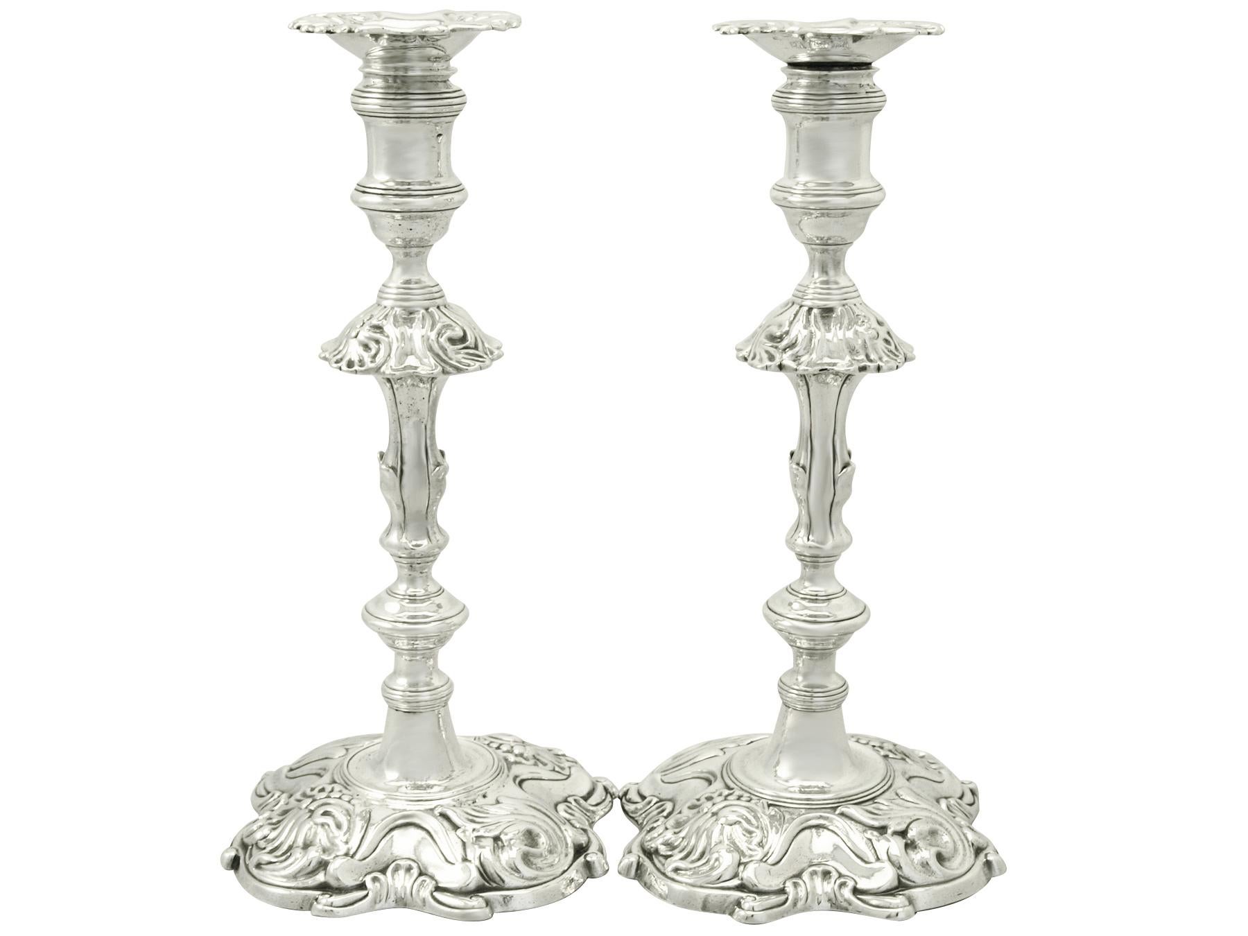 An exceptional, fine and impressive pair of antique Georgian English sterling silver candlesticks; part of our antique ornamental silverware collection.

These exceptional antique George II English cast sterling silver candlesticks have a plain