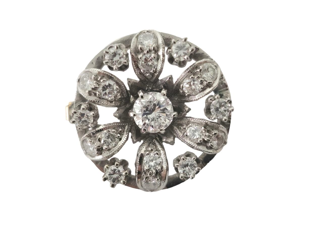 This vintage platinum pin exudes timeless elegance and sophistication. Adorned with a captivating center diamond weighing 0.50 carats and surrounded by 1.25 carats of dazzling diamonds on the sides, this piece showcases the exquisite craftsmanship