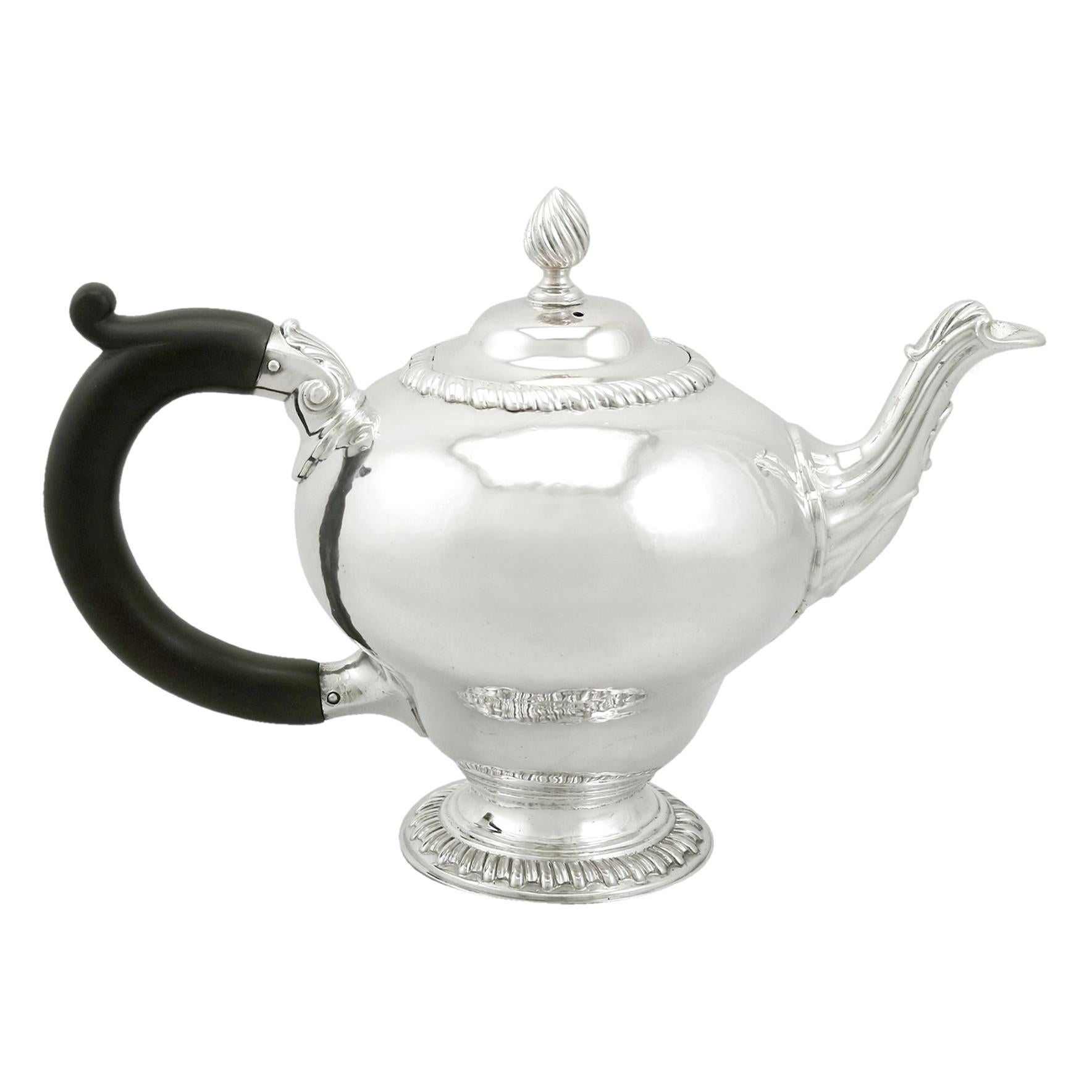 An exceptional, fine and impressive antique George III English sterling silver bachelor teapot; an addition to our Georgian silver teaware collection

This exceptional antique Edwardian sterling silver teapot has an inverted pear shaped form onto