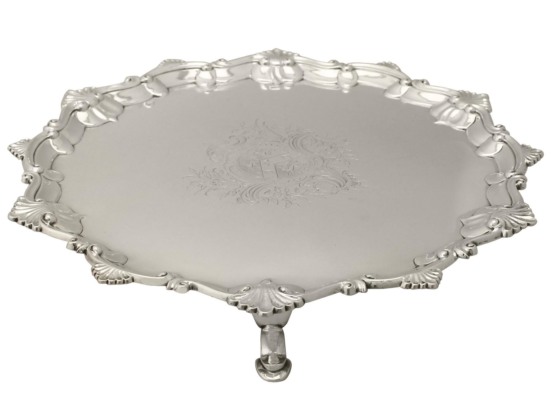 An exceptional, fine and impressive antique George III English sterling silver salver; an addition to our Georgian dining silverware collection.

This exceptional antique George III salver in sterling silver has a plain circular shaped, classic
