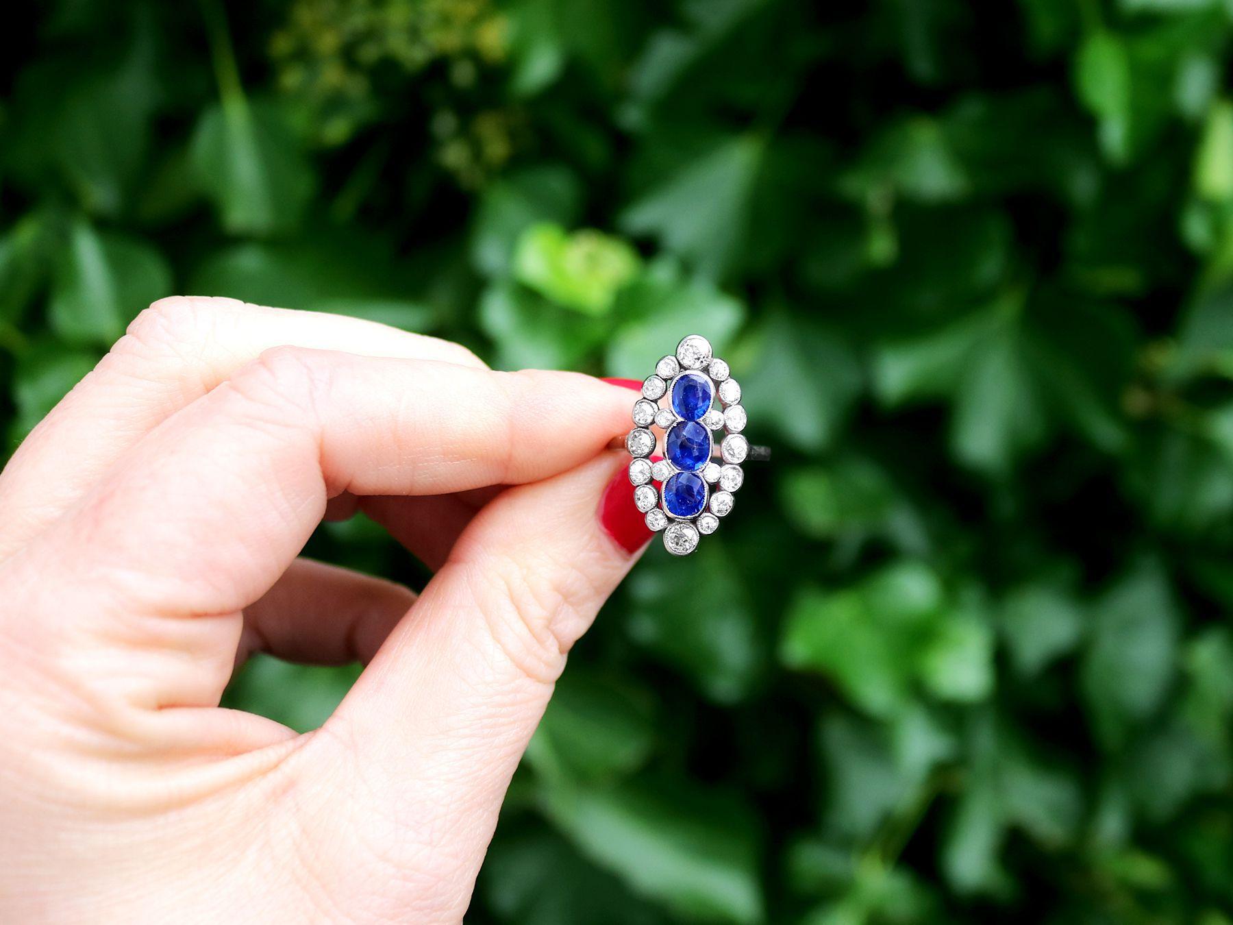 A stunning, fine and impressive antique 1.77 carat natural blue Basaltic sapphire and 1.86 carat diamond, platinum marquise shape ring; part of our antique jewelry collections.

This stunning, fine and impressive antique sapphire and diamond ring