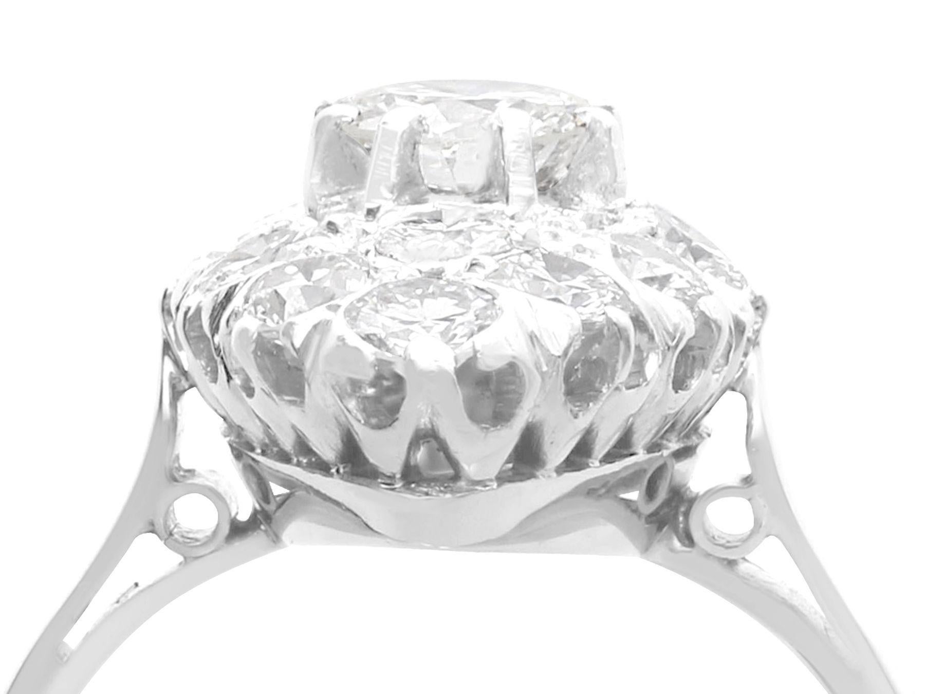 A stunning fine and impressive antique 1.78 carat diamond and platinum, marquise shaped cluster ring; part of our diverse antique jewelry and estate jewelry collections.

This stunning, fine and impressive antique diamond ring has been crafted in