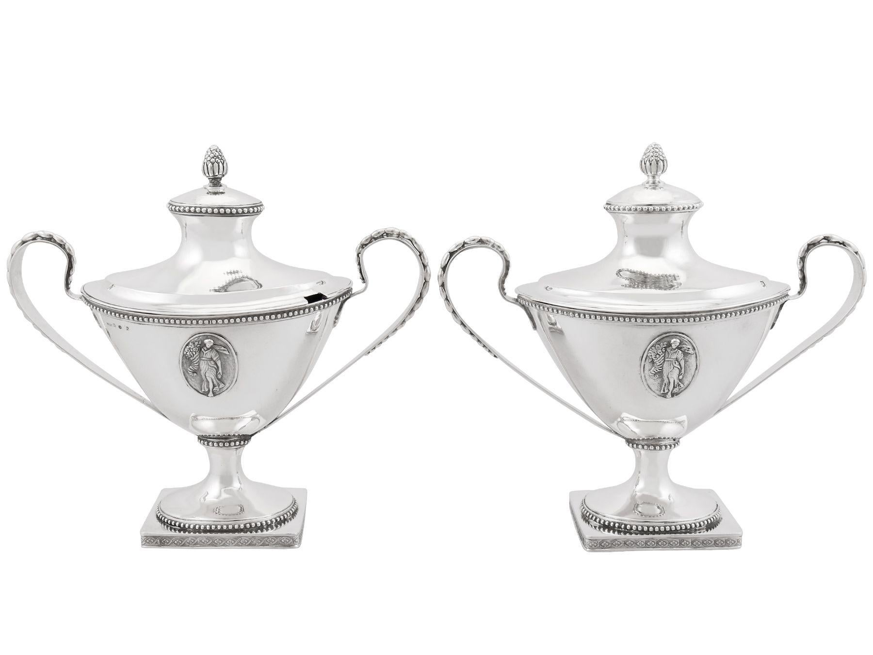An exceptional, fine and impressive pair of antique Swedish silver sauce tureens; an addition to our 18th century silverware collection

These exceptional antique Swedish silver sauce tureens have a plain oval shaped form onto a plain oval