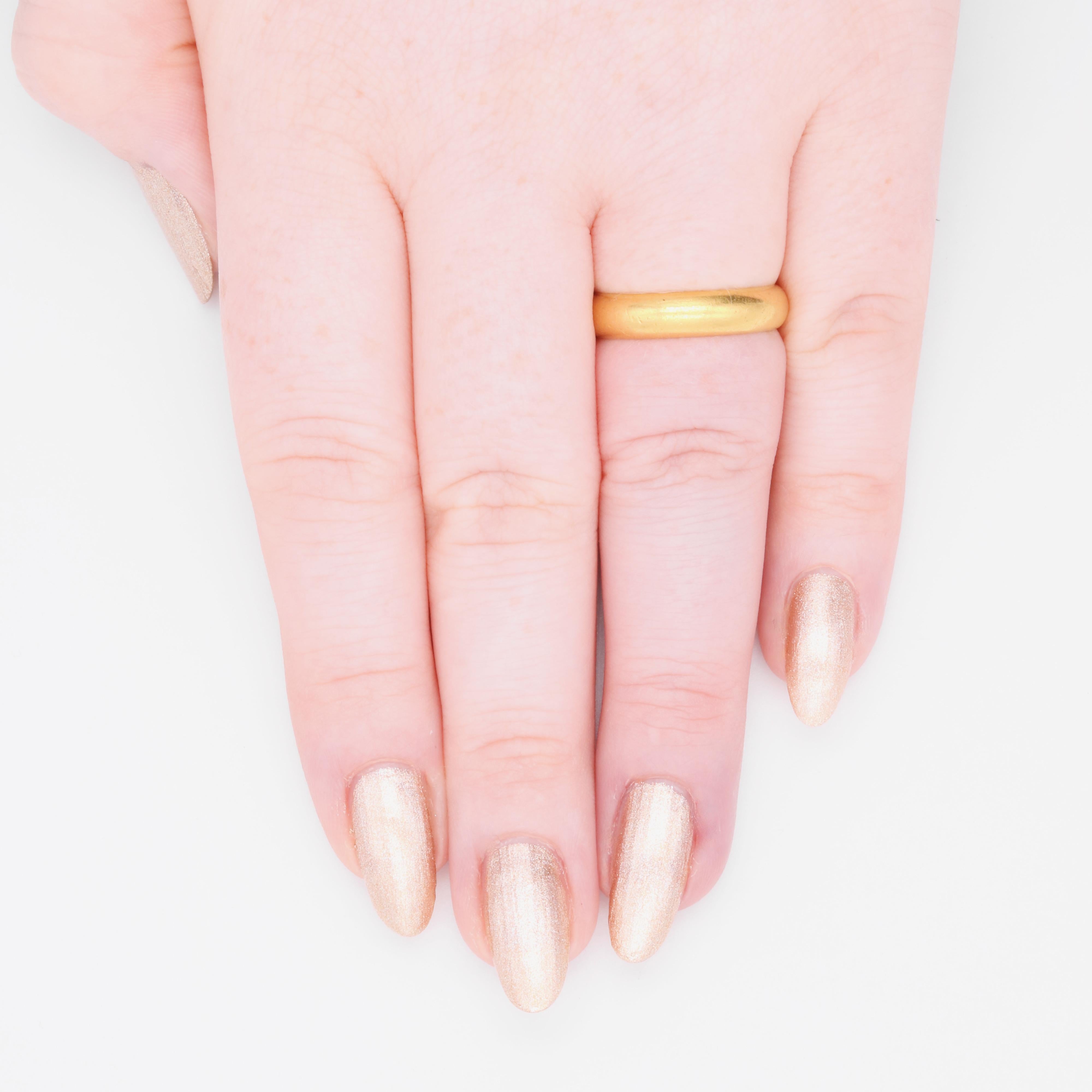A gold ring, with inscription on the inside of the band, in 22 karat yellow gold.  

This gorgeous ring is a posy (or poesy) ring, deriving its name from the French ‘poésie’, meaning poem, because of the short messages engraved on the inside of the