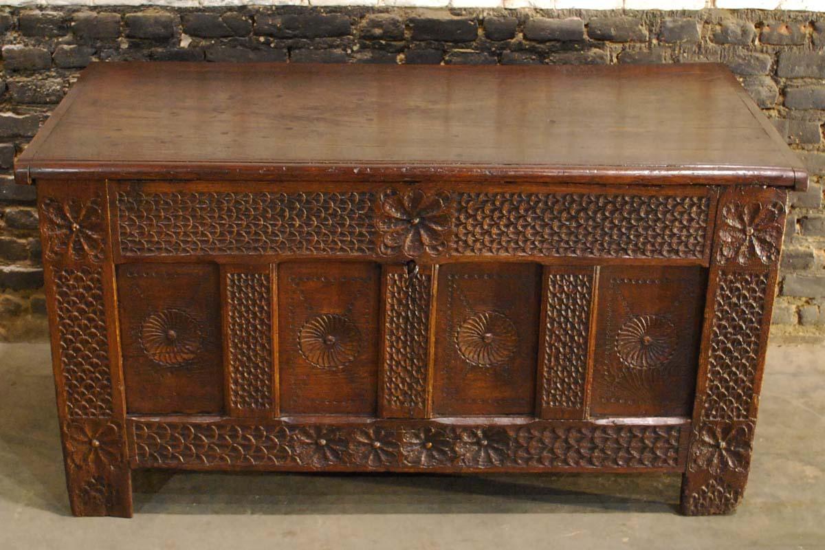 This solid oak carved chest was made in the Netherlands during the Renaissance period. 
It was made in the finest quality oak and high quality carving. The carvings are deep and meticulous. The four panels in the front have geometric circular
