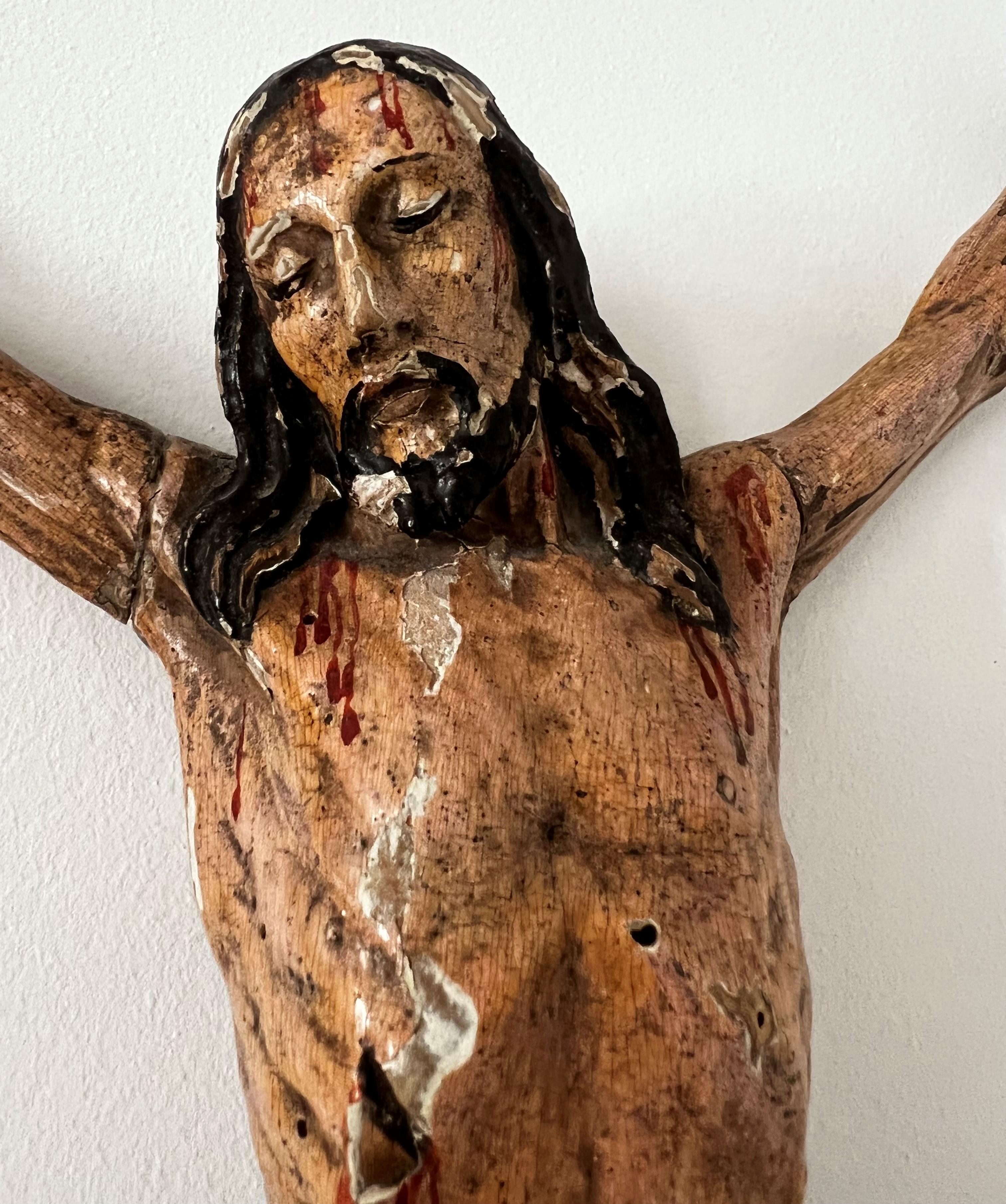 Outstanding and expressive sculpture of Crucified Jesus Christ in carved polychrome wood is approximately from middle 17th century, originated from Italy.  The quality of details is outstanding, specification of the Christ’s face and tensed body,