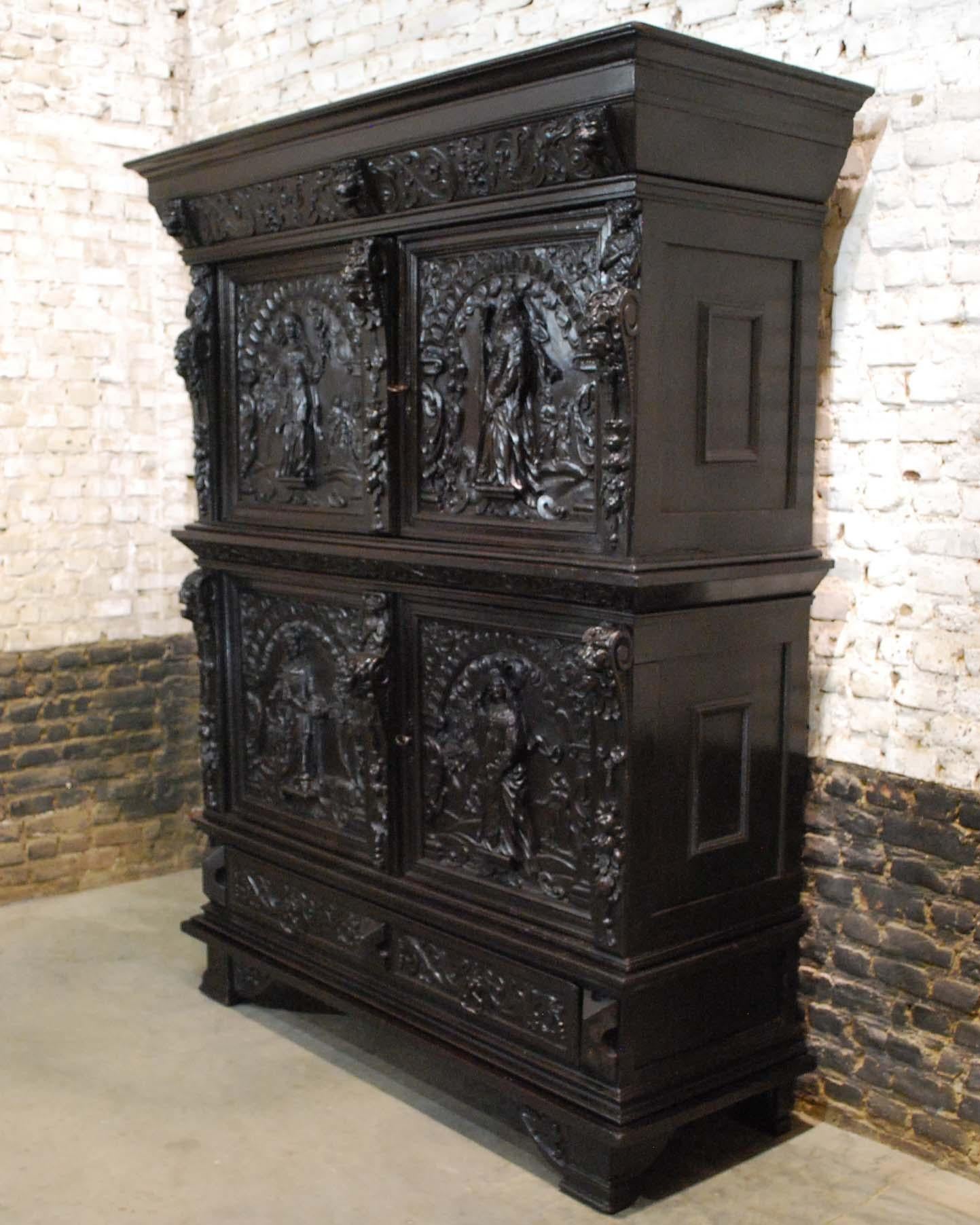 An elaborate and rare Renaissance four-door cabinet that is typical for the second half of the 17th century.
It is heavily decorated with Renaissance ornaments and symbols. This cabinet is made in the southern part of the Netherlands, circa