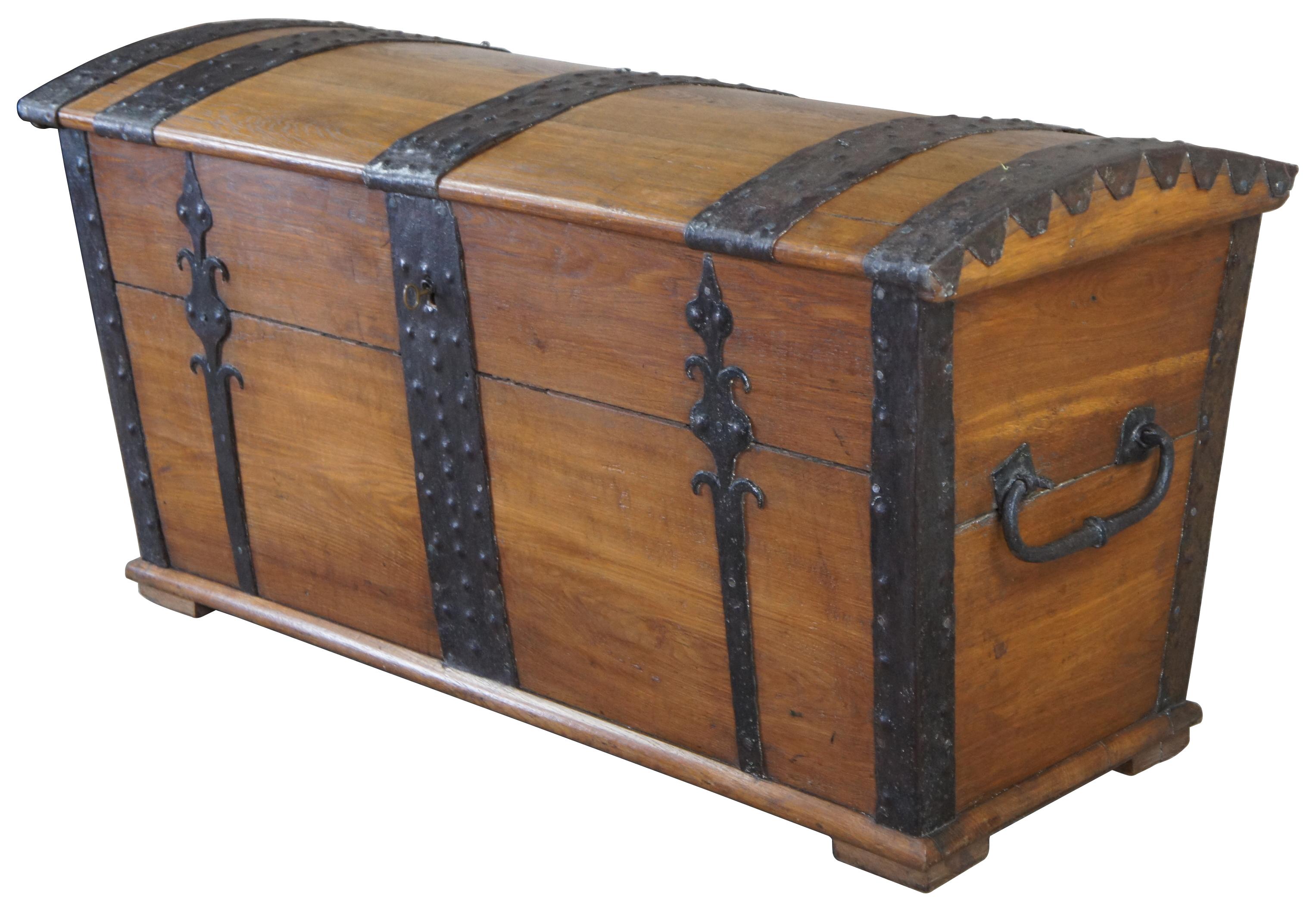Designed to serve as a container for sea transport, sea chests were sometimes elaborately adorned with intricate ironwork as is the case with this museum quality extra large, hinged, dome top chest. The chest has high quality, detailed, decorative