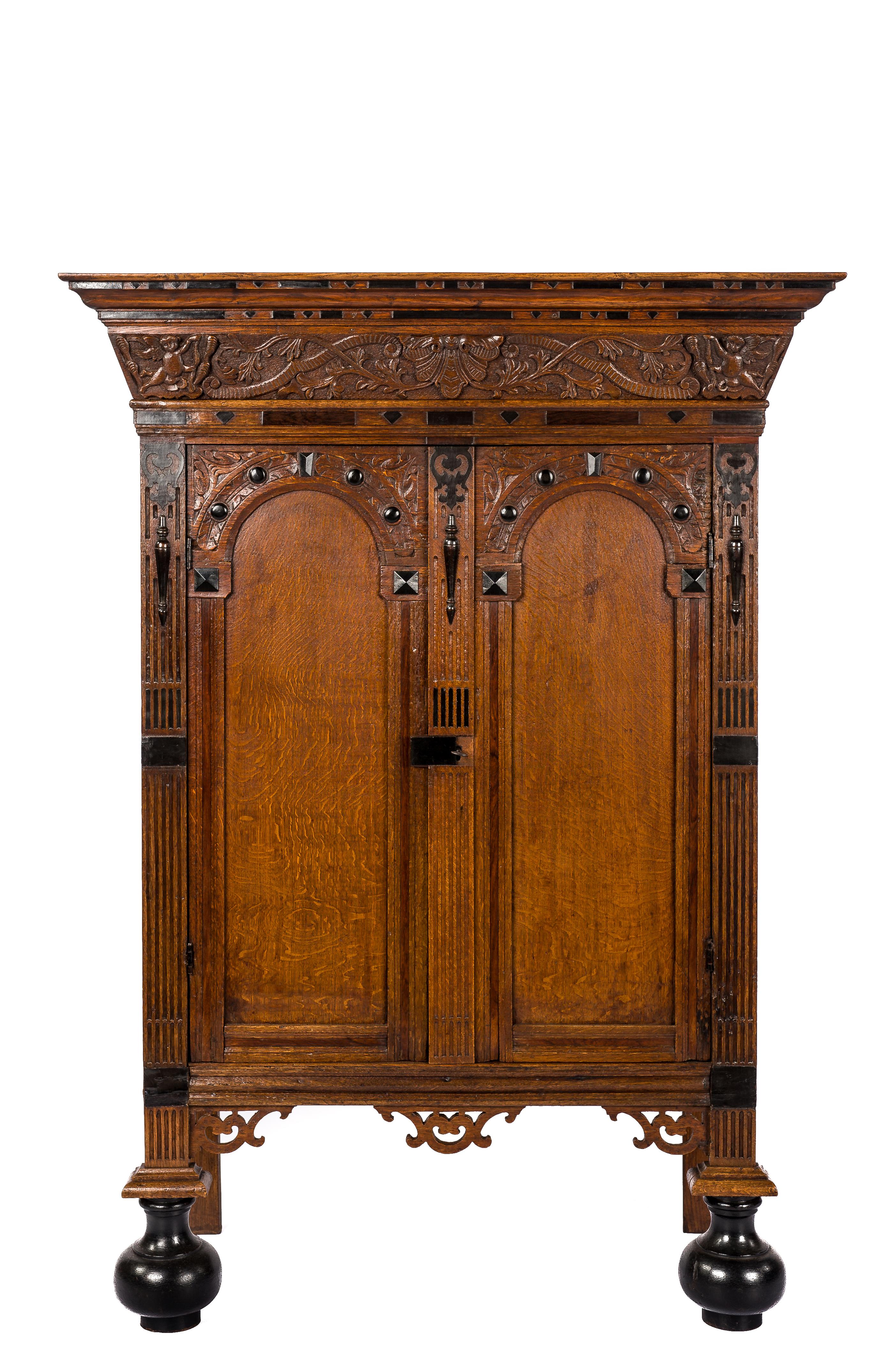 Antique 17th Century Dutch oak and ebony two-door Renaissance cabinet.

This extraordinary cupboard is made of the finest quarter-sawn oak in the tradition of the Dutch Renaissance during the “Dutch golden age” It is a relatively small two-door