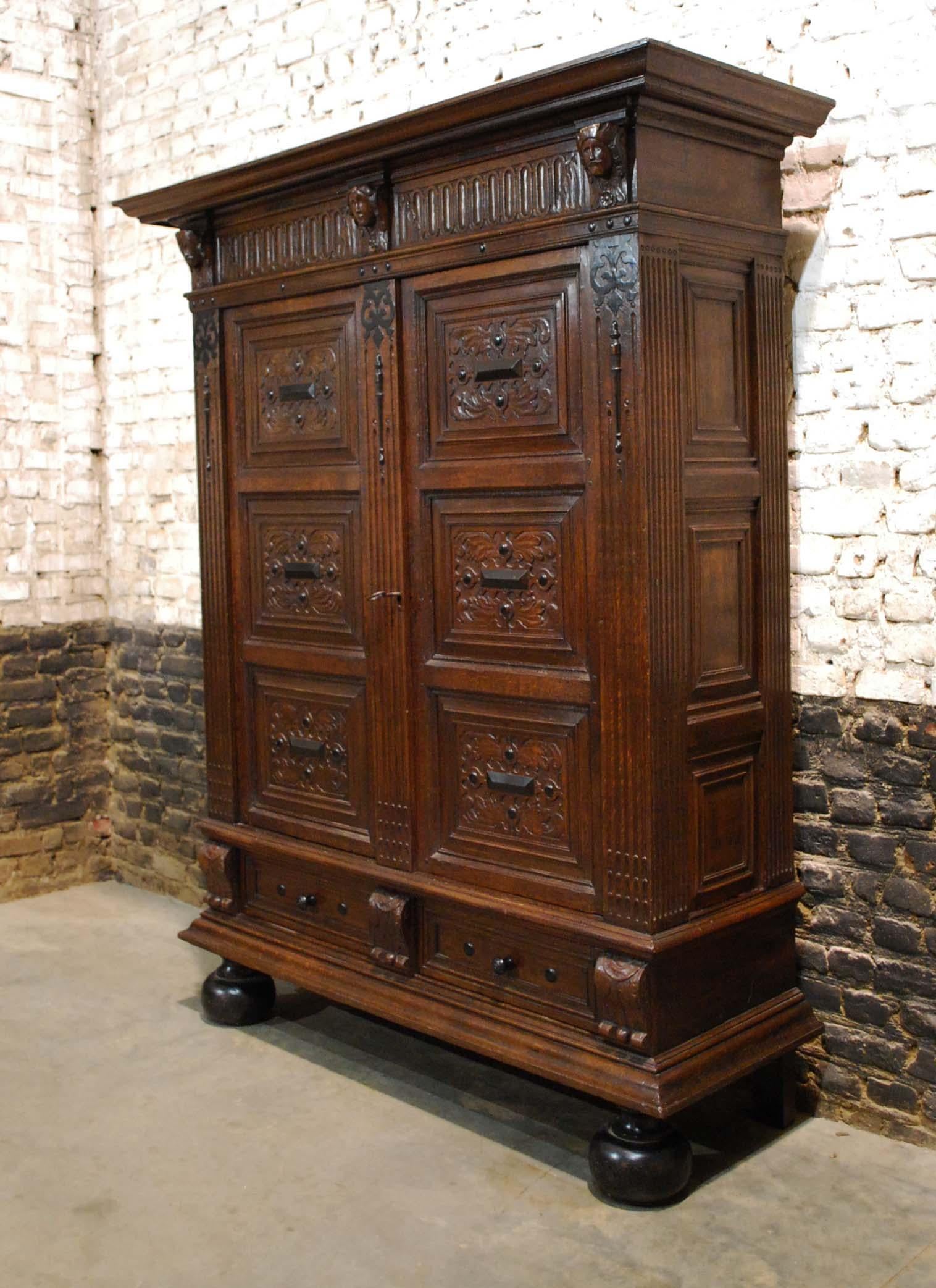 This extraordinary cupboard is made of the finest oak in the tradition of the Dutch Renaissance during the “Dutch golden age” It is a two-door cabinet with one drawer over large bun feet. This cabinet is made in the Provence of “Gelre” circa 1650.