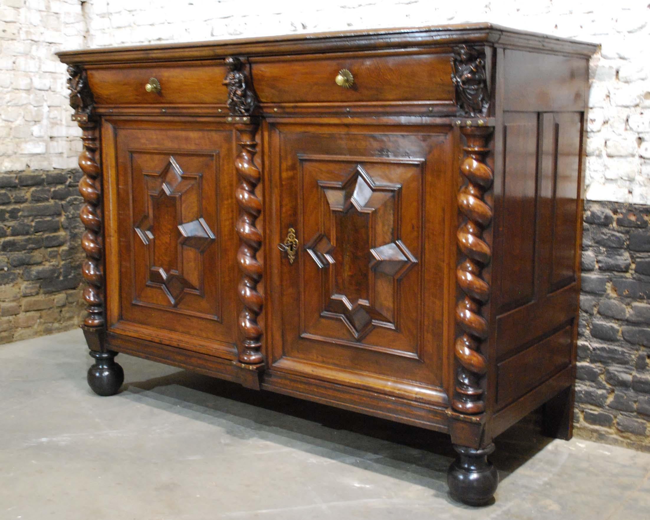 This exquisite and rich decorated Renaissance dresser was made in the Southern part of the Netherlands, circa 1670.
It was made in the finest quality European oak and Walnut during the Dutch Golden Century. The dresser is divided into two doors at