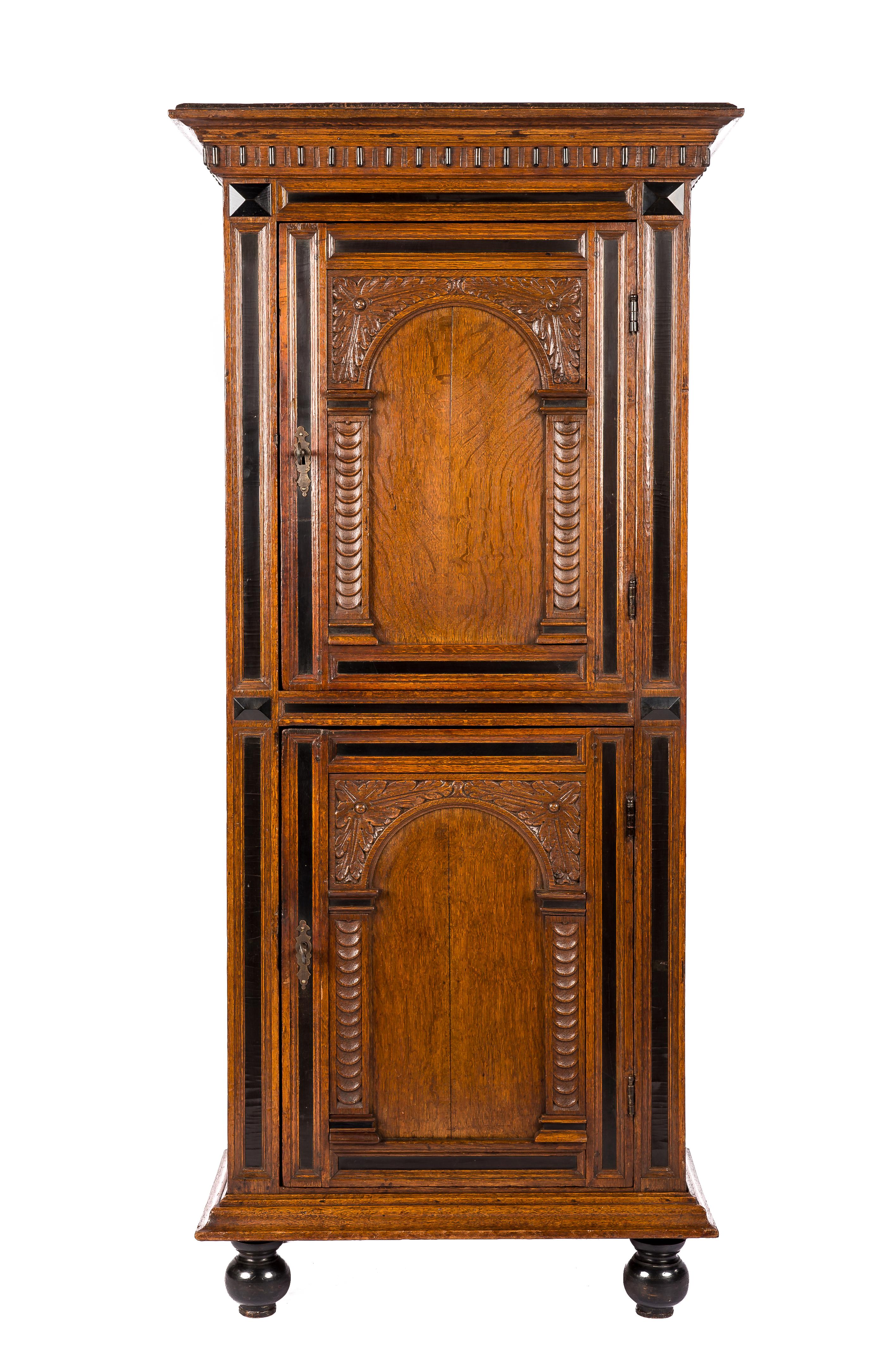 This extraordinary and unique cupboard is made of the finest quarter-sawn oak in the tradition of the Dutch Renaissance during the “Dutch golden age”. It is a relatively small and narrow two-door cabinet with arched doors on top of each other and