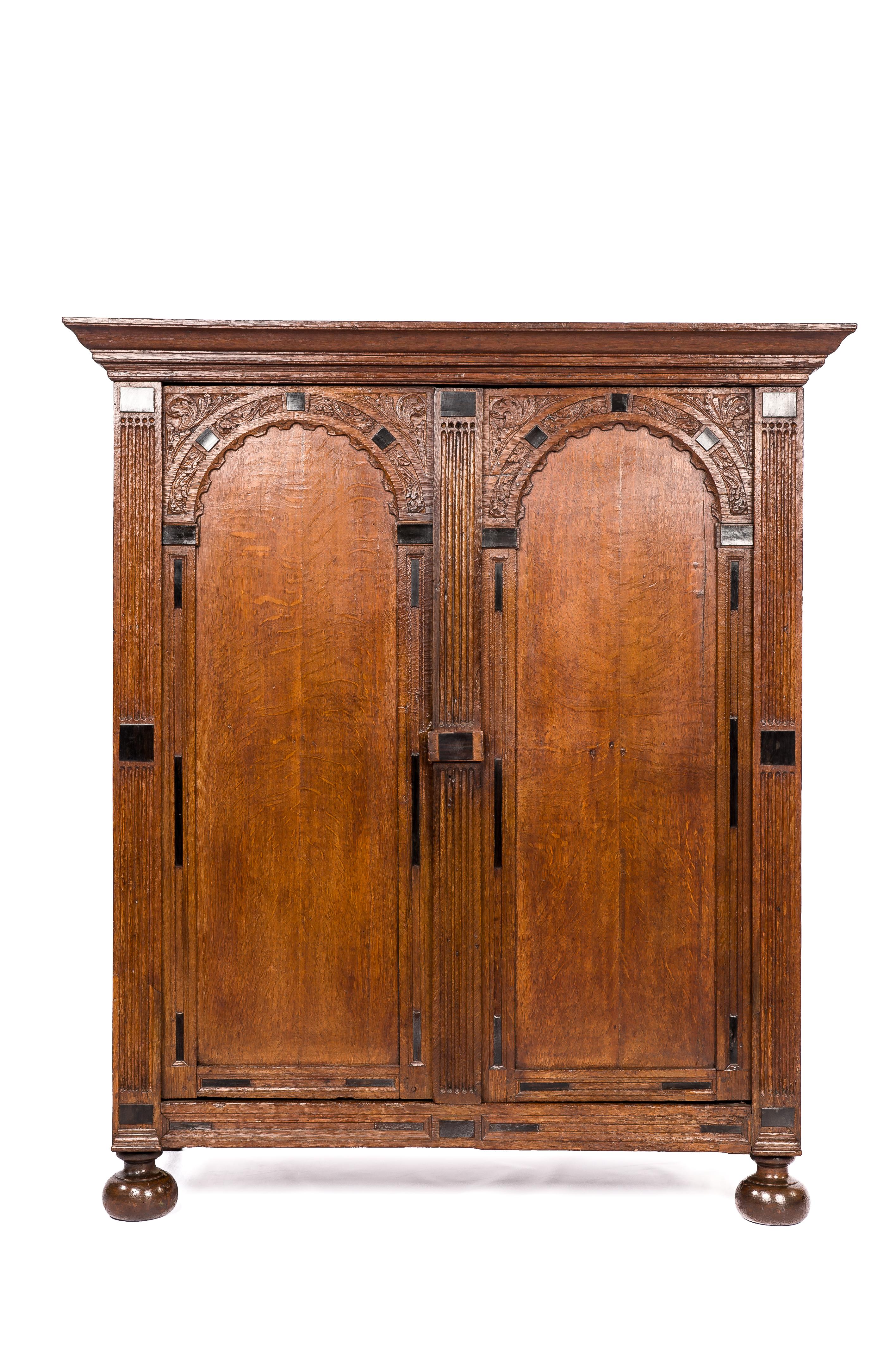 On offer here is an exceptional Dutch cupboard made of the finest European summer oak in the tradition of the Dutch Renaissance during the “Dutch golden age” 
This cabinet is made in the Provence of Utrecht, circa 1680. The arched doors are typical