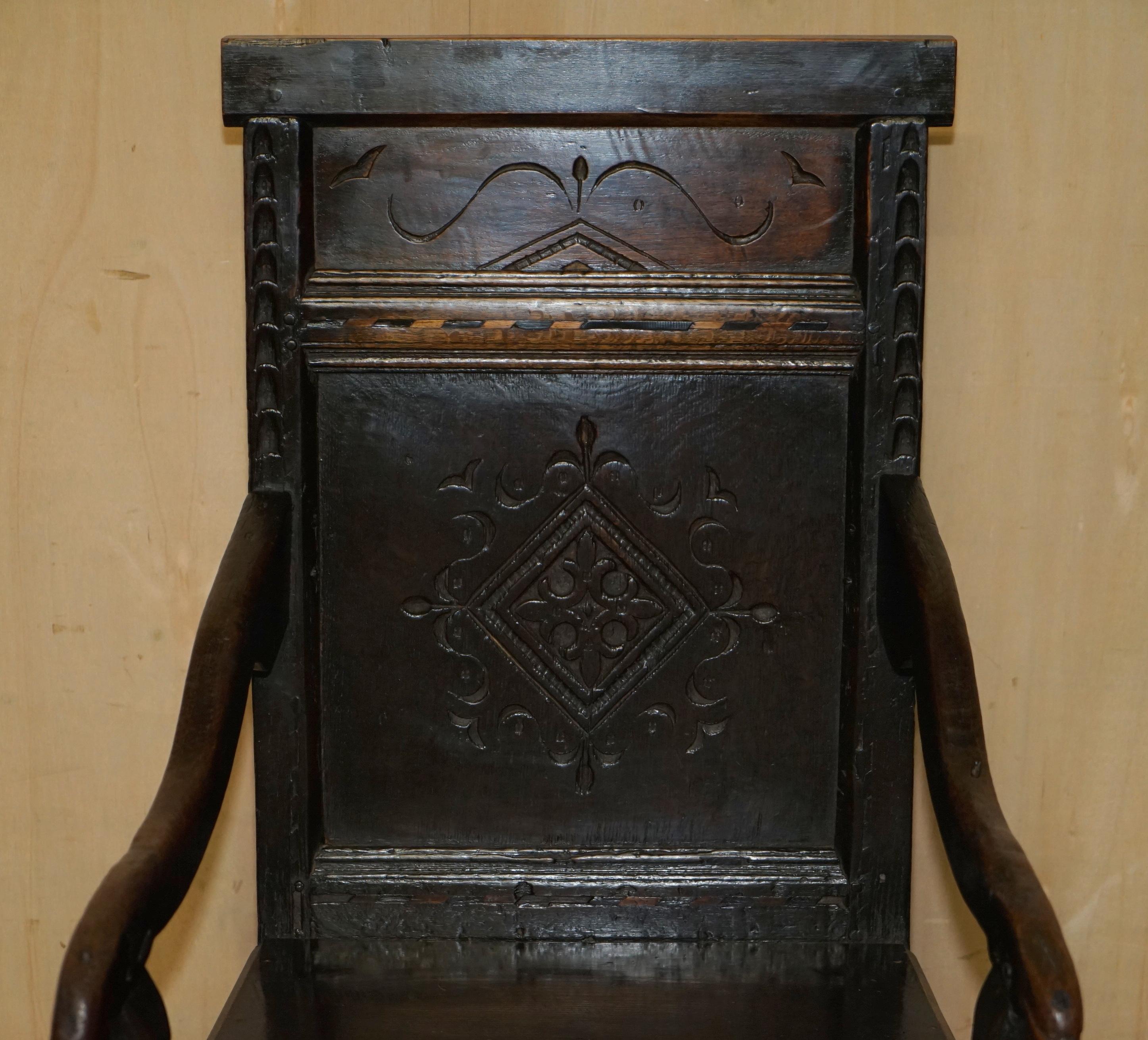 Hand-Crafted Antique 17th Century Jacobean Hand Carved English Oak Armchair Tudor Panelling For Sale