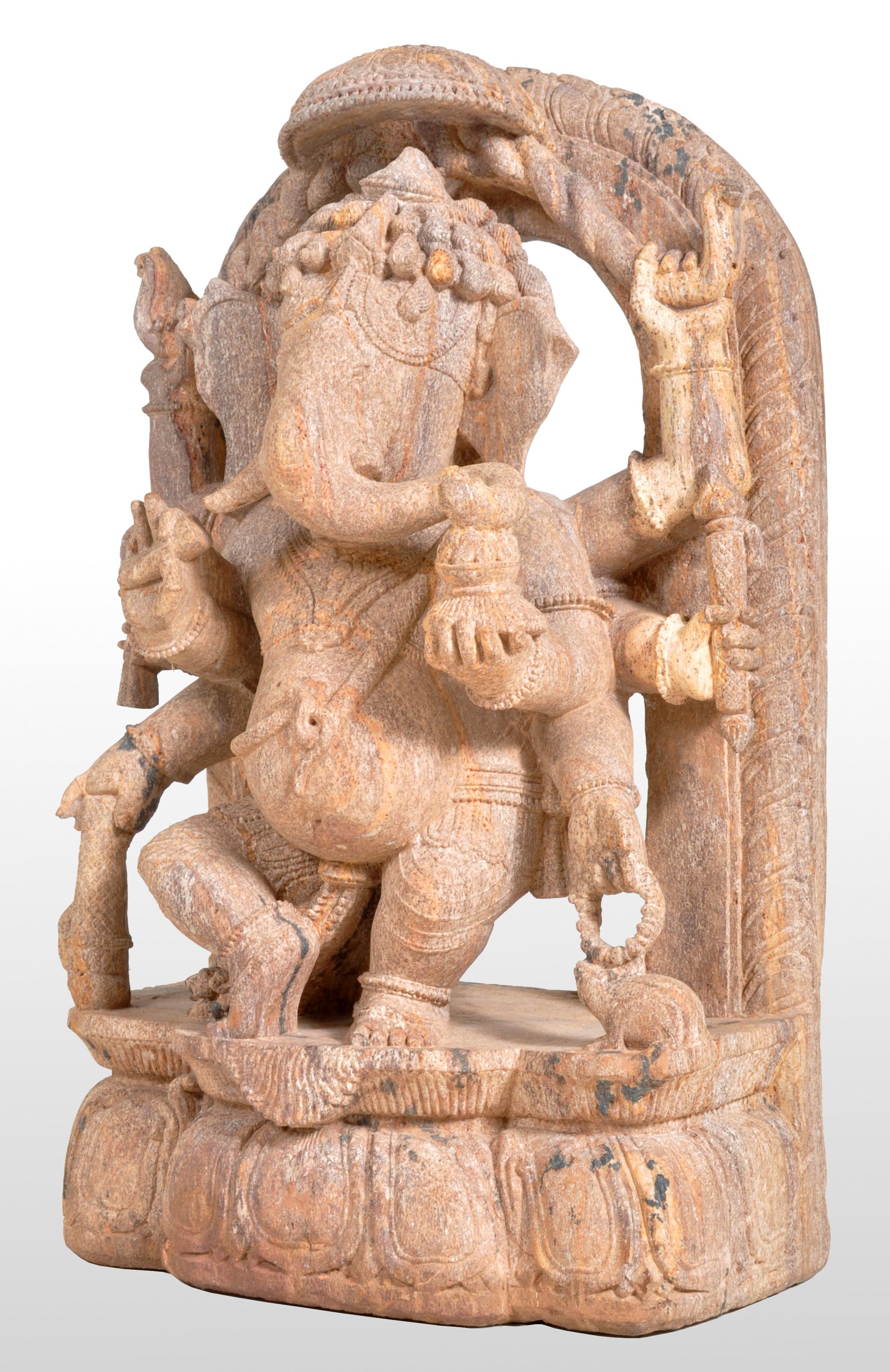 Antique 17th Century Indian Hindu Carved Sandstone Ganesh Statue, Stele, 1600's. The eight-armed statue having traces of the original polychrome decoration, the statue holding a Chatra (umbrella) above, and standing on a lotus-shaped base. The