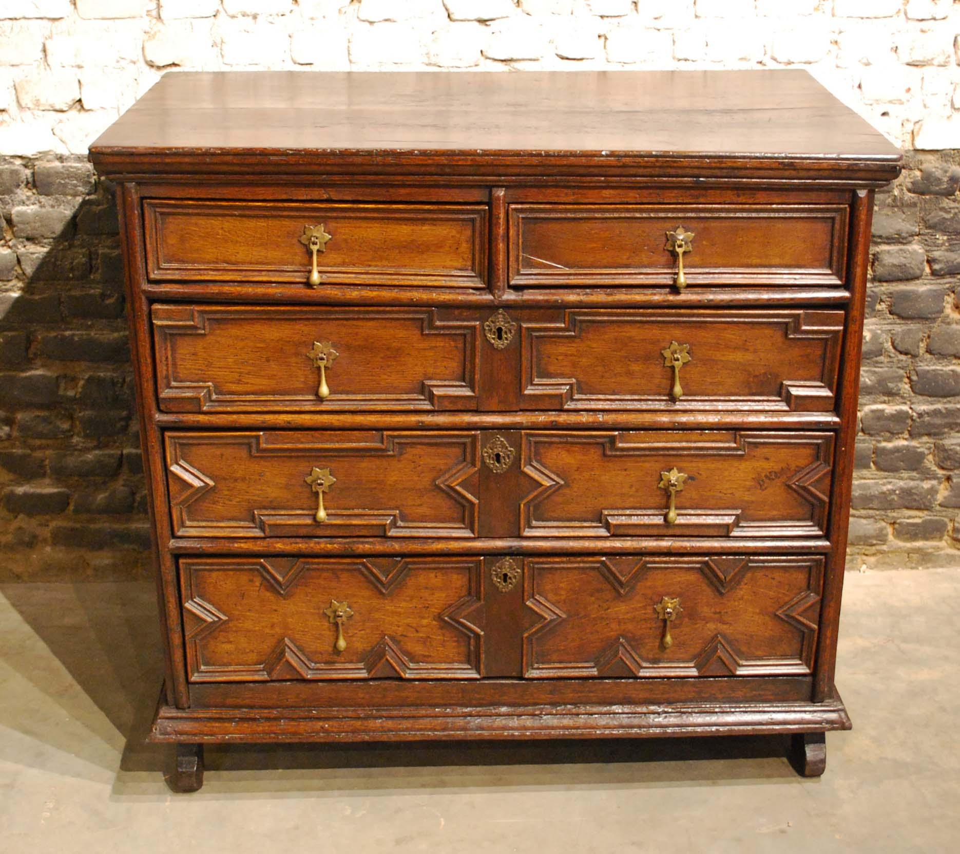 A beautiful chest of drawers made in the finest quality summer oak. The pared-down geometric mouldings are typical for a 17th century Charles II chest. The top is made from two pieces of oak with a great grain pattern and has a moulded edge. The