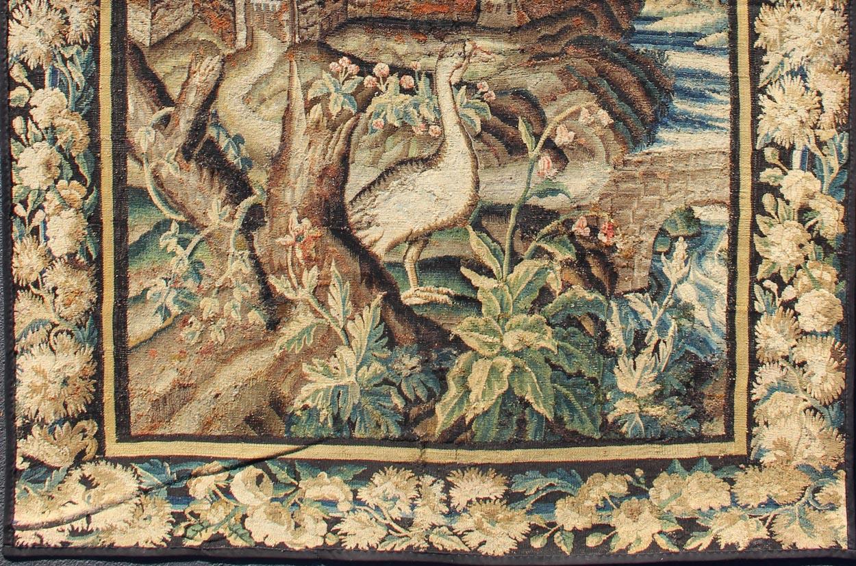 This enchanting antique 17th century tapestry beautifully illustrates the remarkable sense of depth and richness that was perfected by artisans of the 17th century. A remarkable display of abundant vegetation and a multiplicity of flora, in a wide