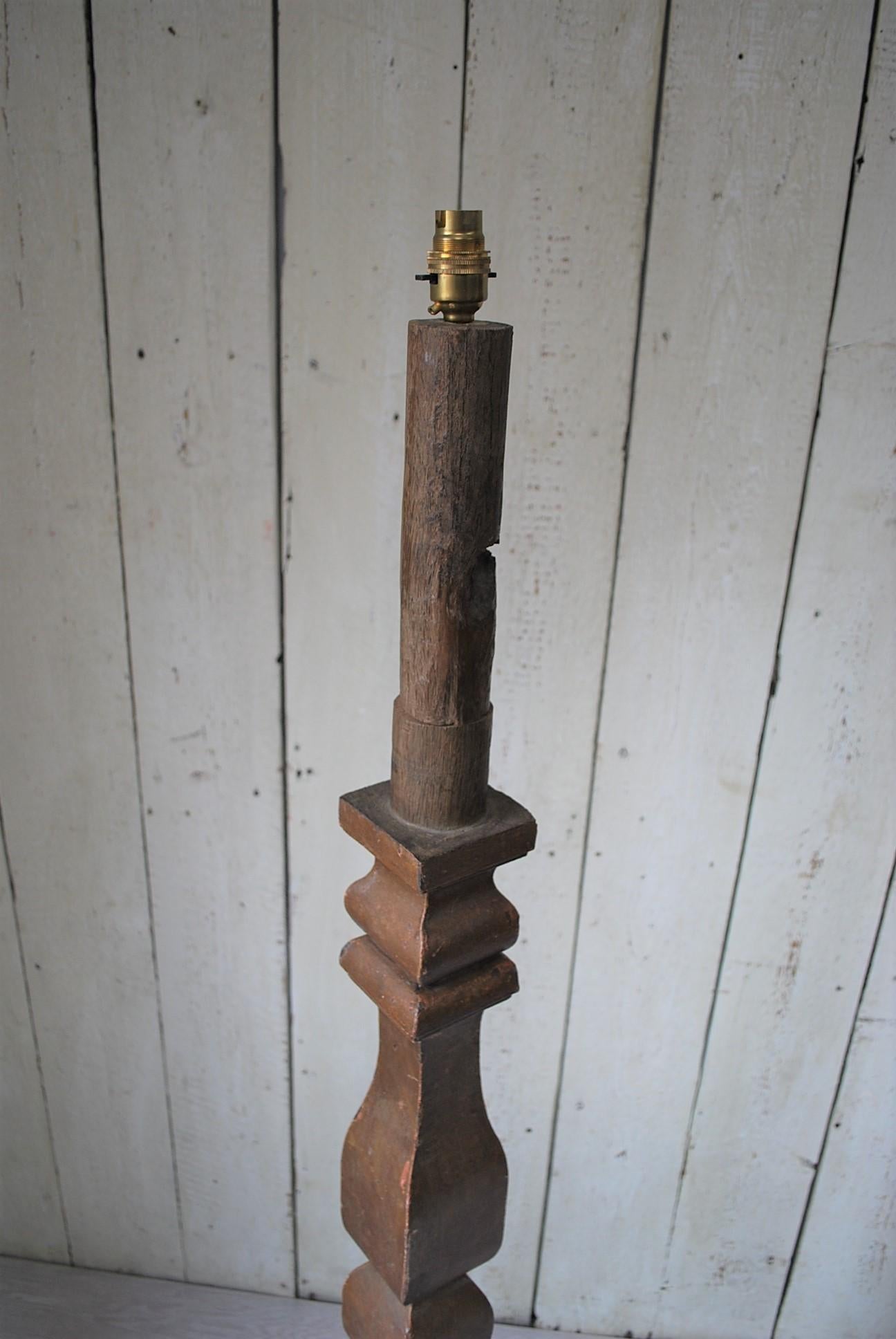 A rare and unusual 17th century antique French standard lamp converted to electric. Standing on a stepped triangular base with a square baluster column. Still retaining its original scumble paint on top of solid oak. Very sturdy and has now been