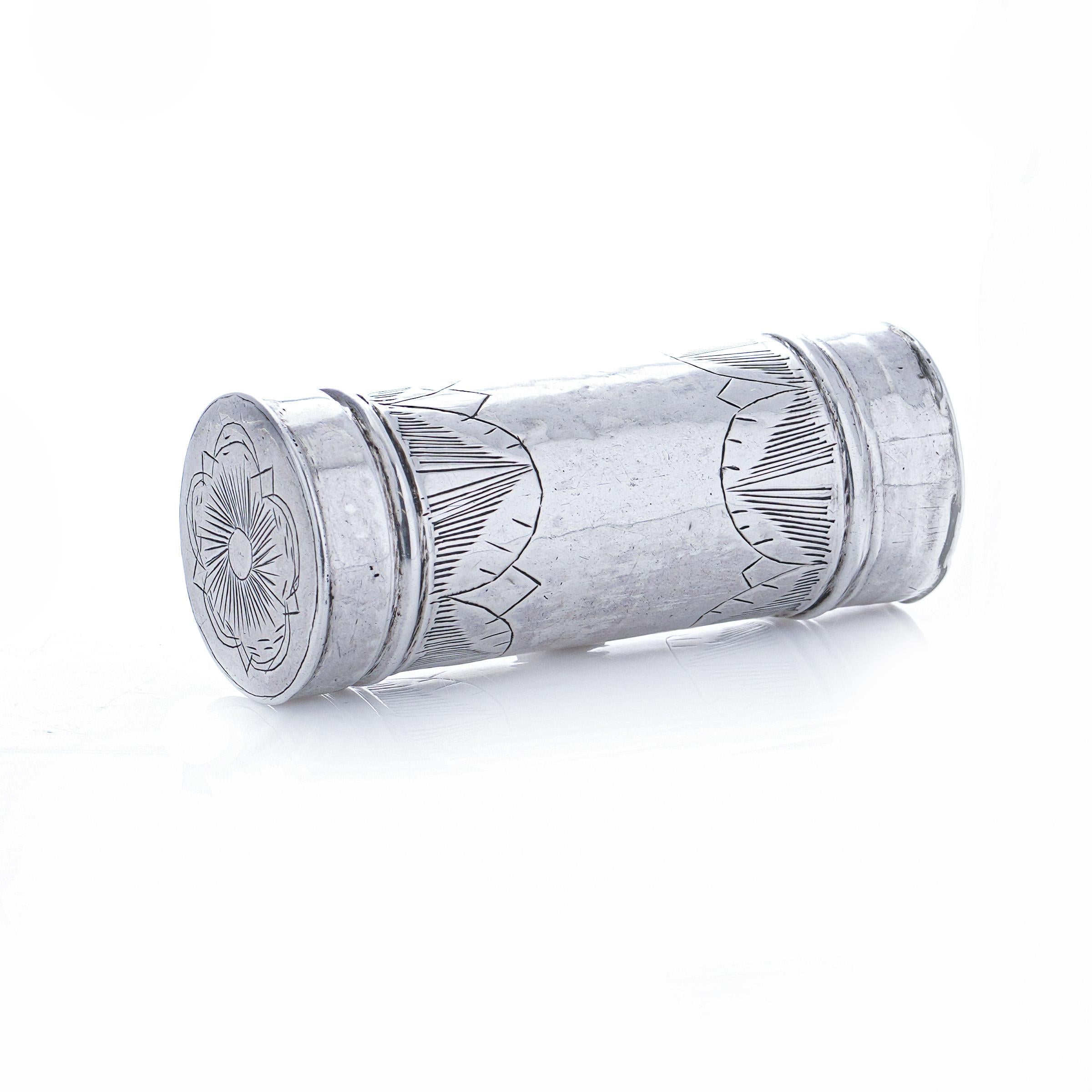 Antique 17th century sterling silver tubular nutmeg grater seamlessly blends functionality with historical charm. Crafted in England in 17th century, this exquisite item boasts a silver grater encased within its tube, while the removable lid is