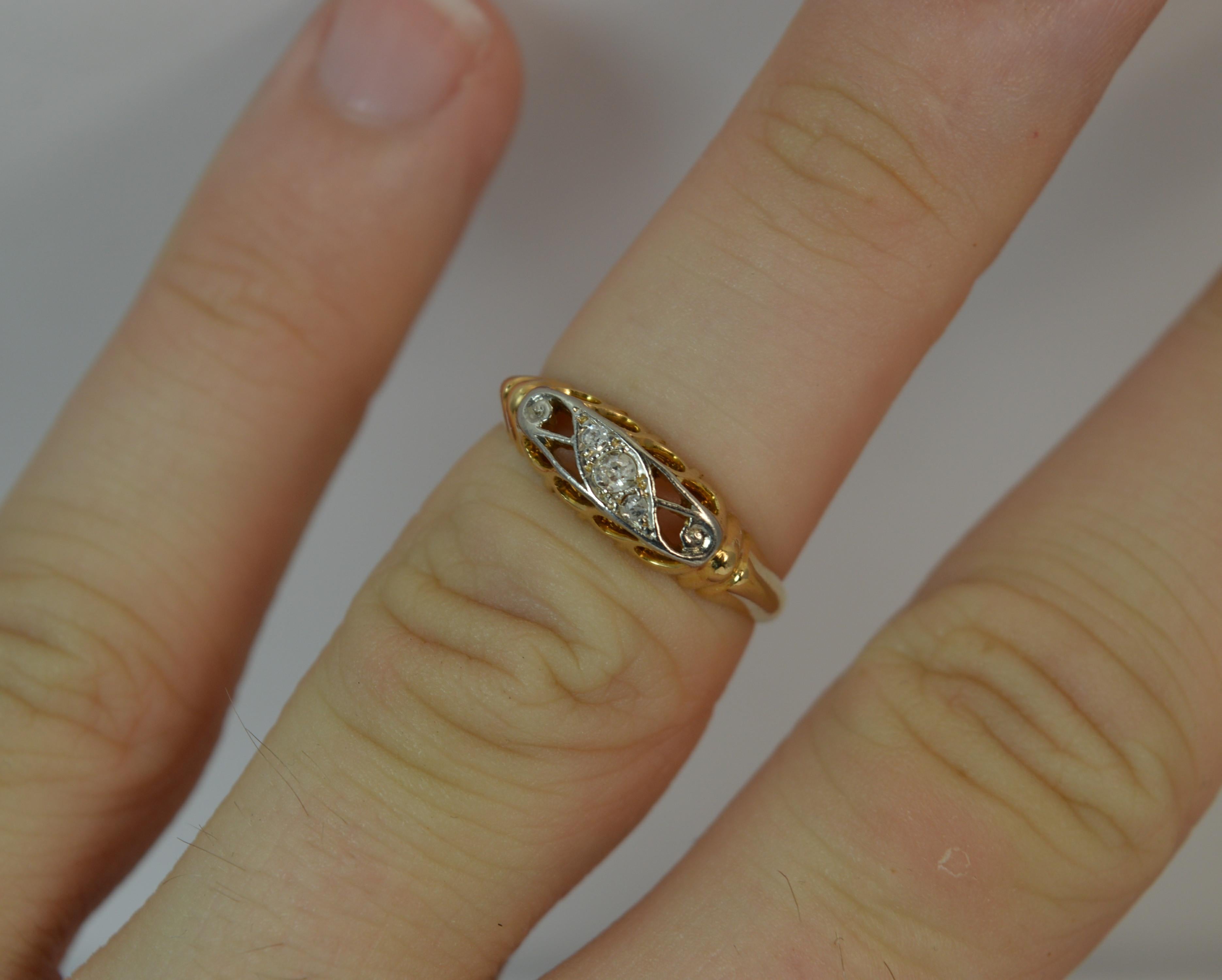 
A gorgeous true antique five diamond boat ring. 18 carat yellow gold example. Set with three old cut diamonds in a palladium setting. Ideal stack ring.

​11.5mm spread of stones, 5mm thick band to front.

Size J UK, 4 3/4 US. 2.3 grams. Very good