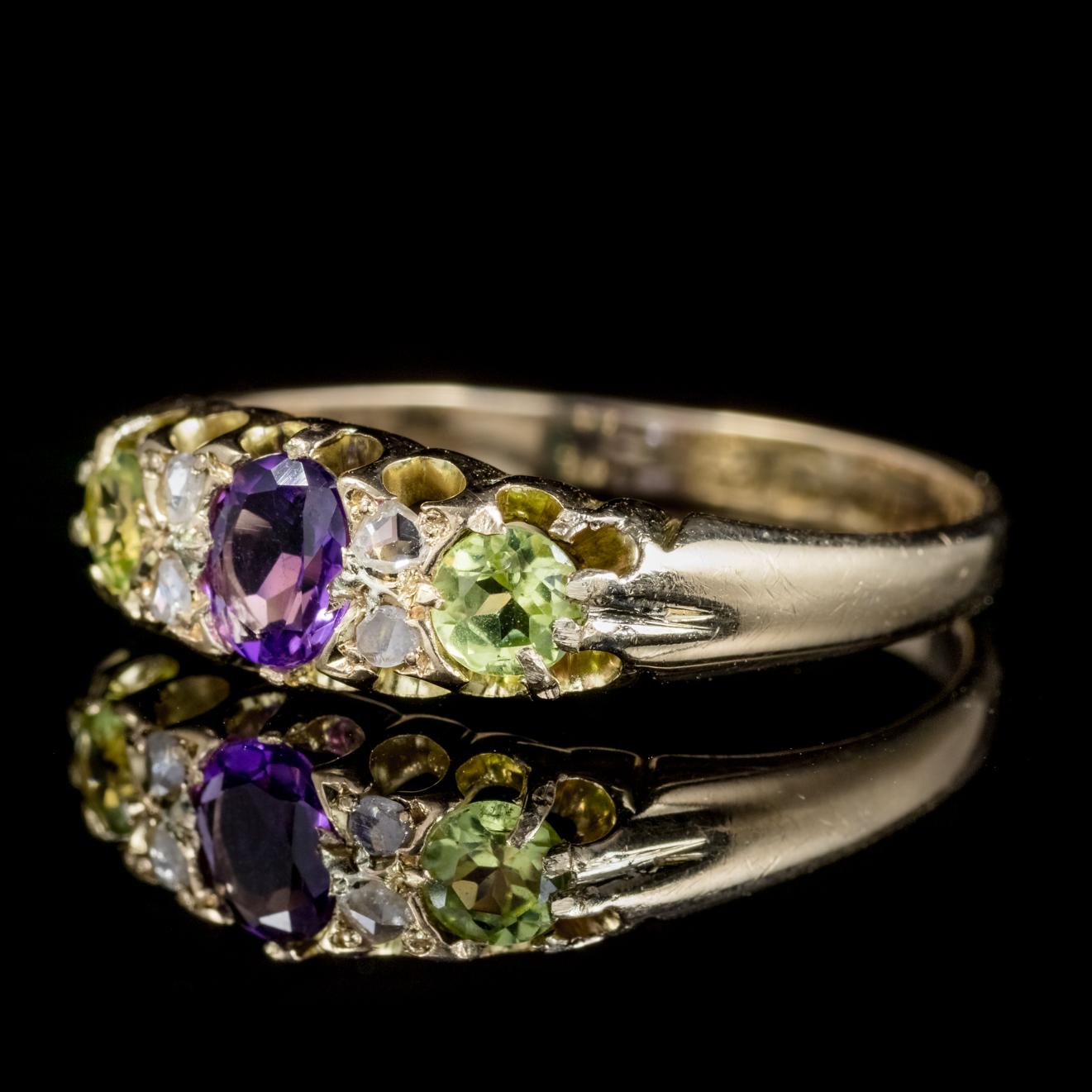 A beautiful antique 18ct Gold Suffragette ring from the Victorian era, Circa 1900.

Adorned with a central violet Amethyst which is approx. 0.30ct and flanked by four sparkling Diamonds and two rich green Peridots.

Suffragettes liked to be depicted