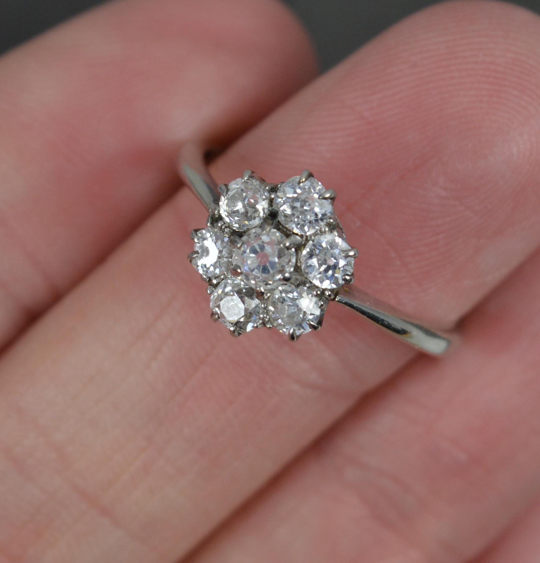Antique 18 Carat White Gold and 0.8 Carat Old Cut Diamond Daisy Cluster Ring In Excellent Condition For Sale In St Helens, GB