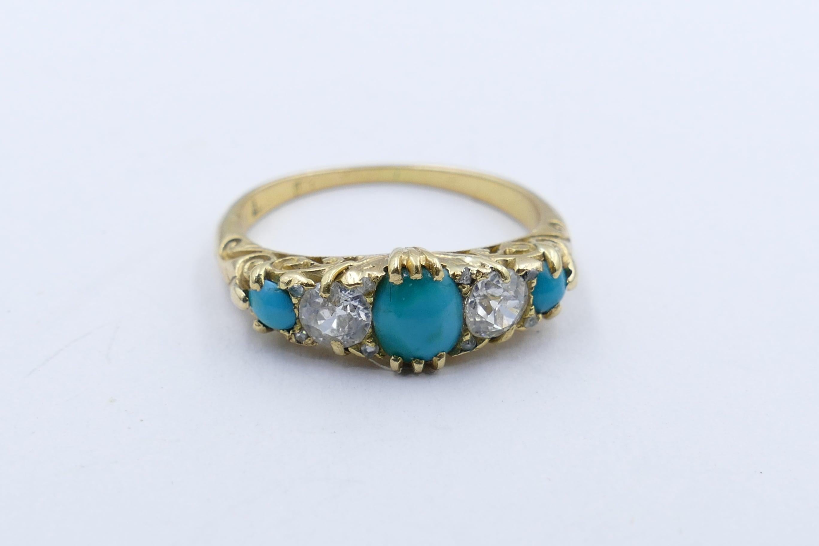 This lovely old Victorian/Edwardian Ring is comprised of 3 good mid-blue Turquoise stones with the addition of 2 old cut Diamonds & 4 smaller rose cut Diamonds. 
One Turquoise measures 6.0 X 4.5mm with the remaining 2 measuring 2.5mm.
The 2 Diamonds