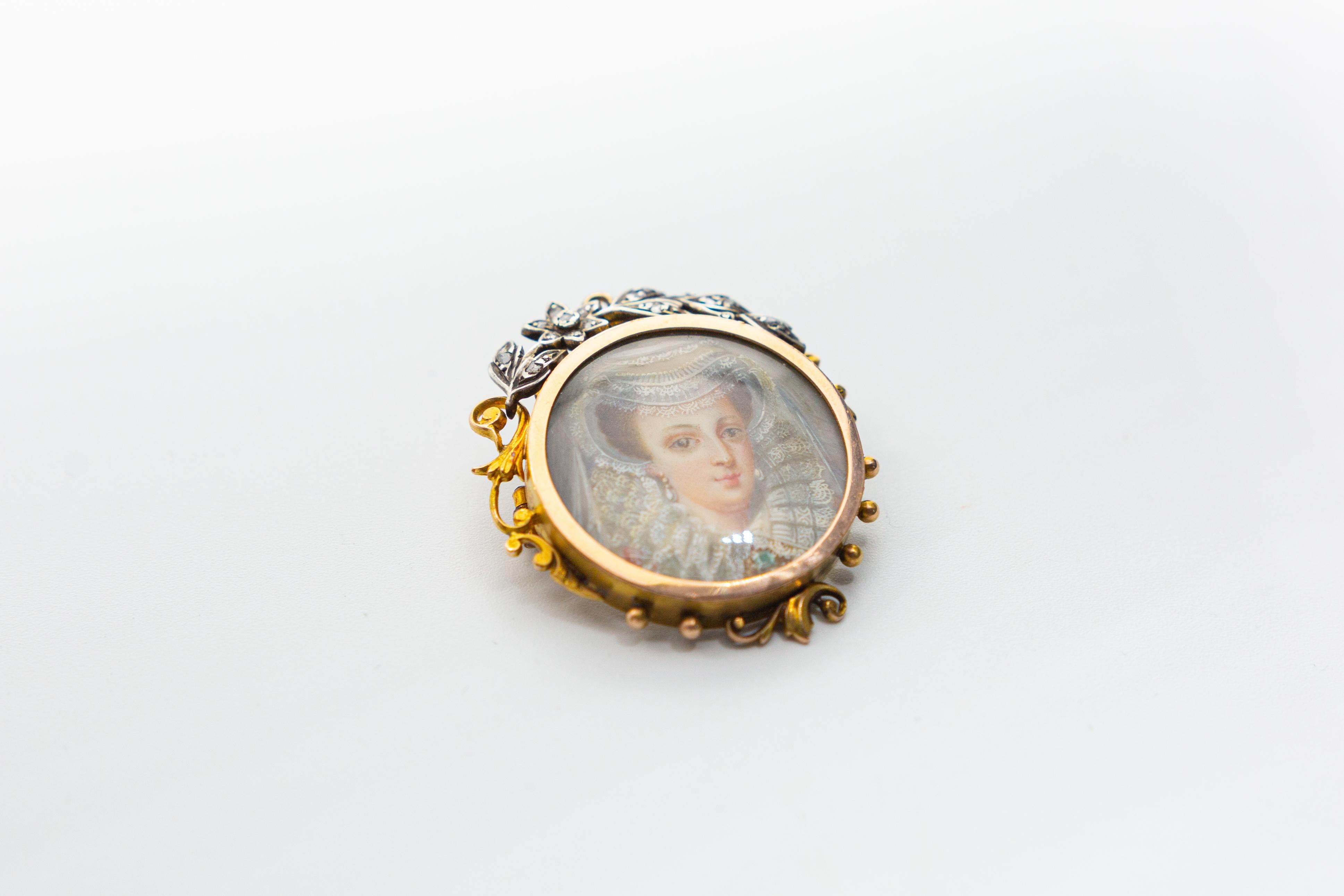 Antique 18 k gold with rose-cut diamonds. The brooch is Victorian. It’s a miniature hand-painted painting on mother of pearl back. It measures 1.5 inches in height and measures 1.35 inches wide. it weighs 1,72 grams. It does have a loop on which one