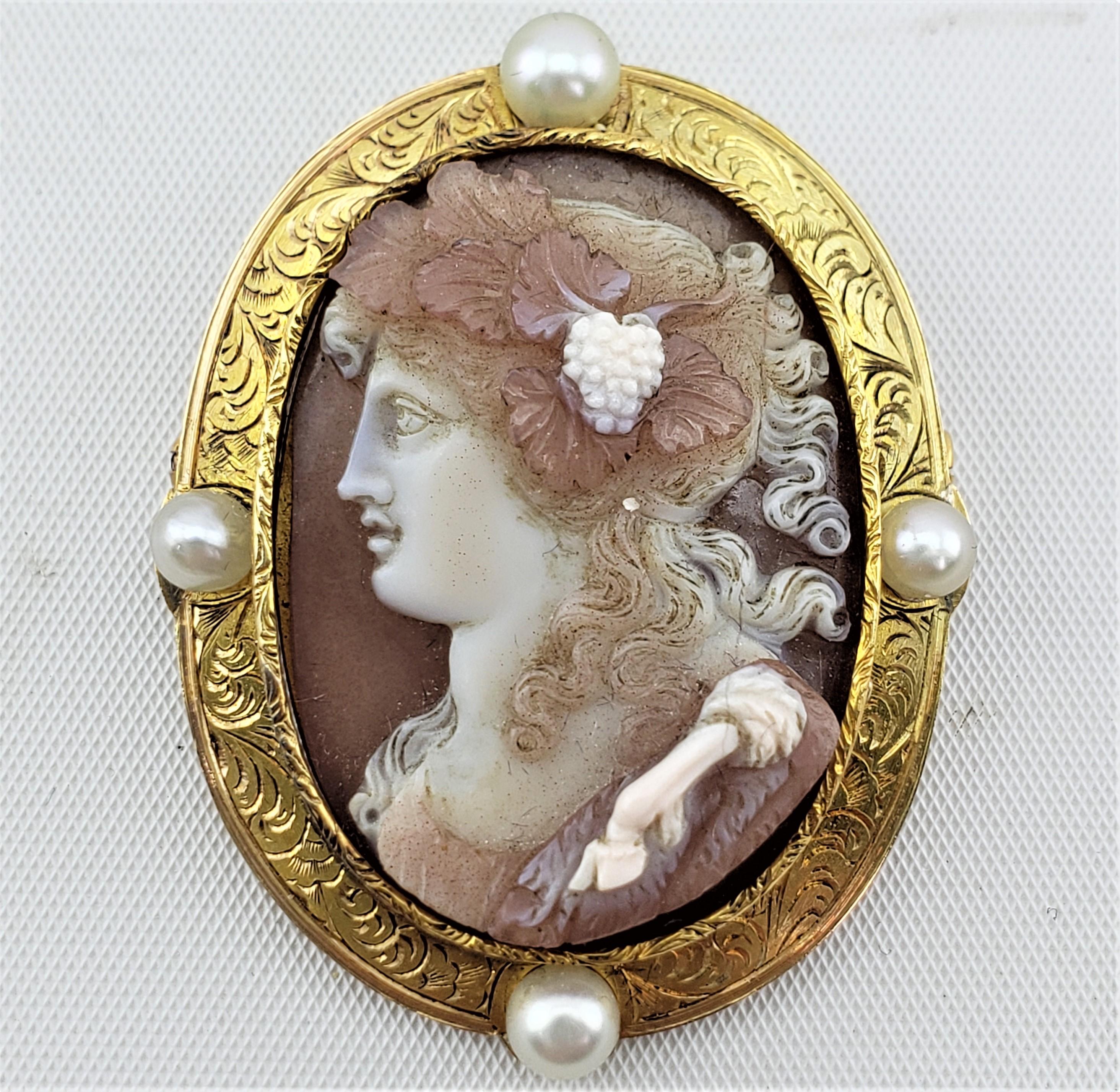 This antique brooch is unsigned, or marked, but presumed to have originated from Italy and date to approximately 1850 and done in a period Renaissance Revival style. The bezel is unmarked, but acid tests to at minimum 18 karat gold and is engraved