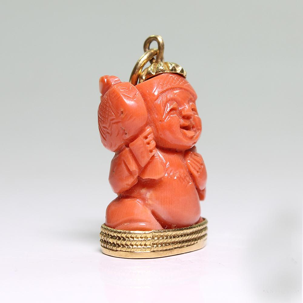 Period: Art deco (1920-1935)
Composition: 18K Gold.

Stones:

•	1 natural Buddha shape red coral.
Pendant measures: 30mm by 17mm 
Thick: 10mm
Total weight: 9.5grams – 6.1dwt 

This purchase comes with a professional appraisal document for the amount