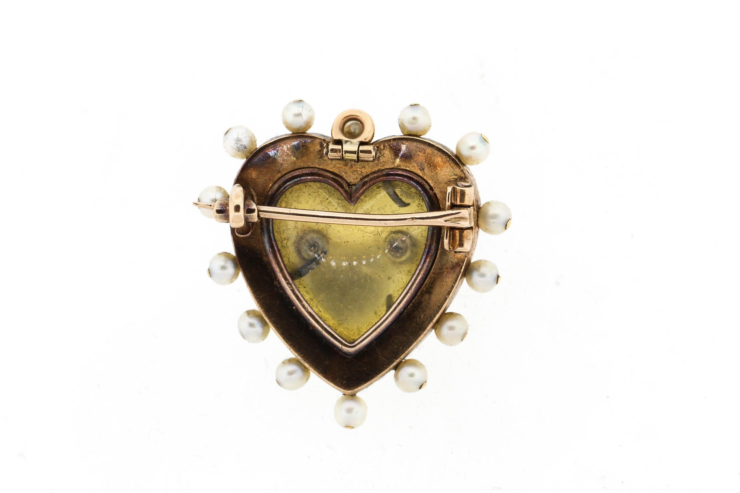 A bright antique 18k gold green and white enamel heart pin/pendant set with rosecut diamonds and pearls. The front of the pin has two pearls surrounded by diamonds in a double heart shape. Such a classic sentimental Victorian design. The green