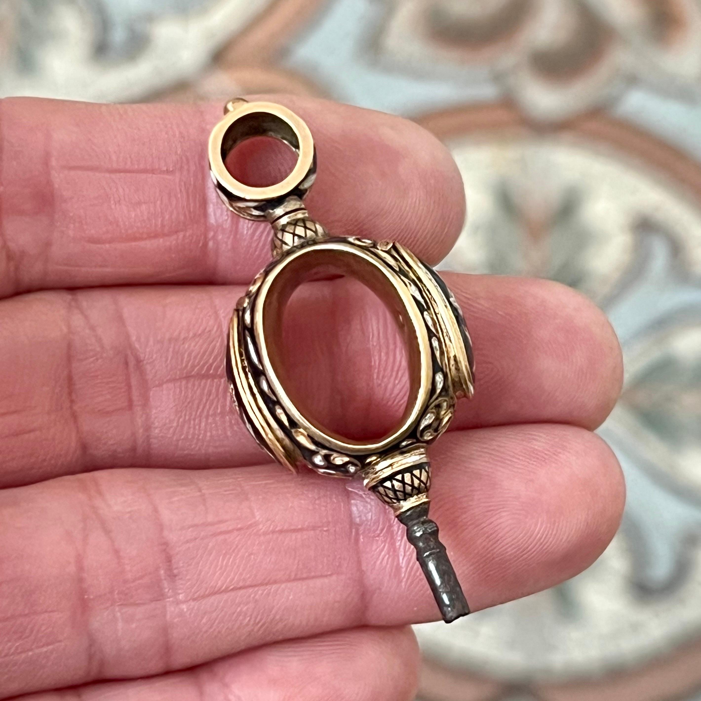 This exceptional pocket watch key is a fine example of 19th-century horological artistry and the luxurious accessories that accompanied the gentleman’s watch. Beautifully executed in 18 karat rose gold, the piece is richly embellished with black and