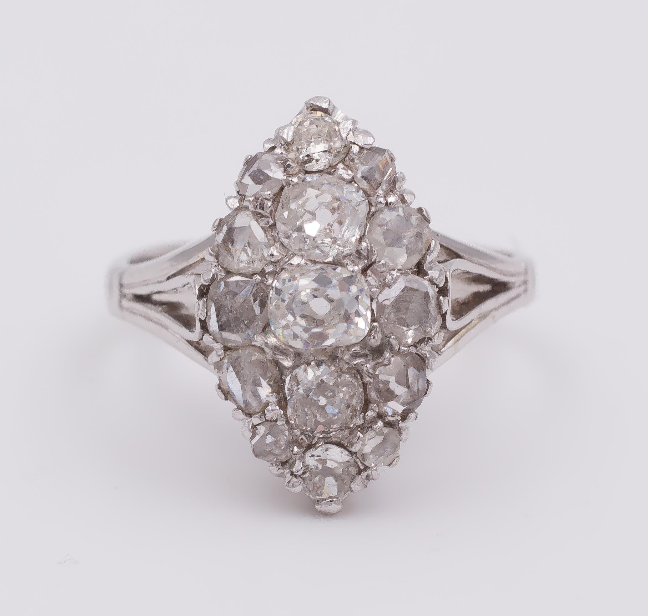 This very elegant and beautiful navette ring is modelled in 18K white gold throughout and dates from the 1930s. 
It is set with ten rose cut diamonds, surrounding a central row of five round cut diamonds, totalling 0.8ct ca.  

MATERIALS
18K white