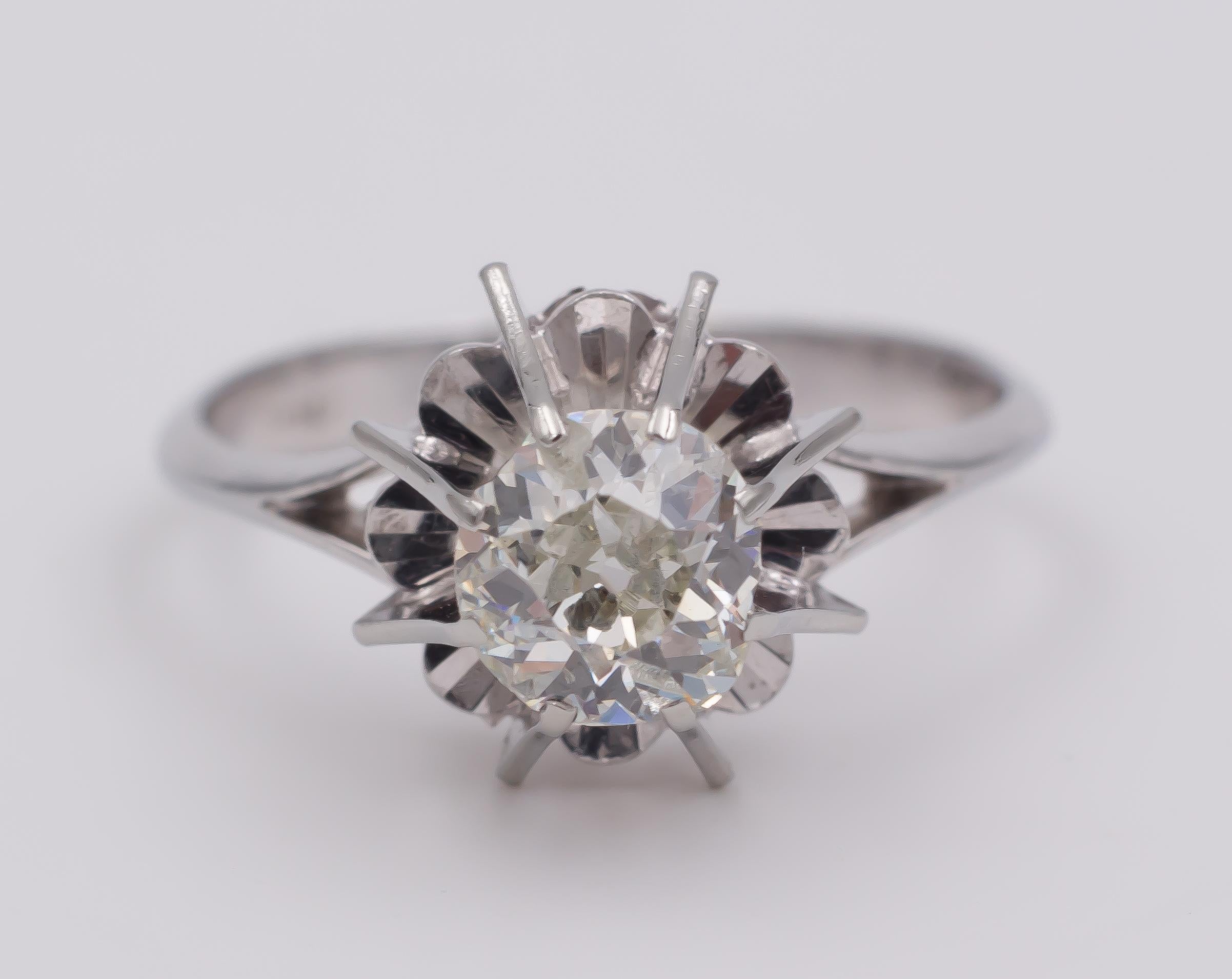 A stunning antique solitaire ring, dating from the 1940s; it is crafted in 18K white gold throughout and it's set with a central round cut diamond. 

MATERIALS
18K white gold and a central round cut diamond

RING SIZE
7¾ US (resizable)