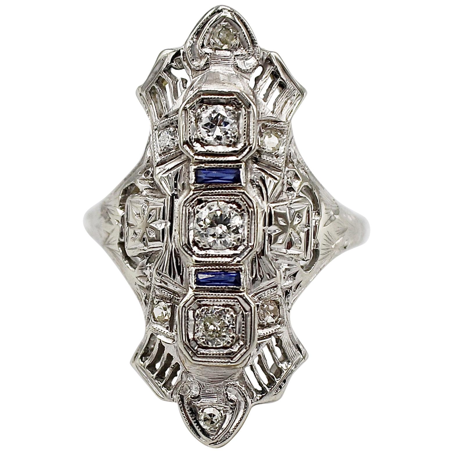 Antique 18 Karat White Gold Natural Diamond and Sapphire Navette Cocktail Ring