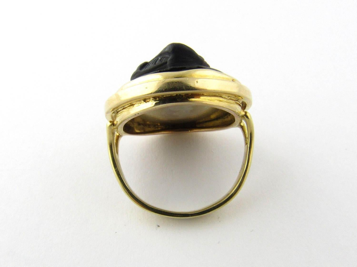 Antique 18 Karat Yellow Gold Black Matte Julius Caesar Cameo Ring Size 6

This unique ring features a profile of Julius Caesar detailed in black onyx with a matte finish. Cameo measures 29 mm x 24 mm. Shank: 4 mm. Some wear noted on onyx due to age.