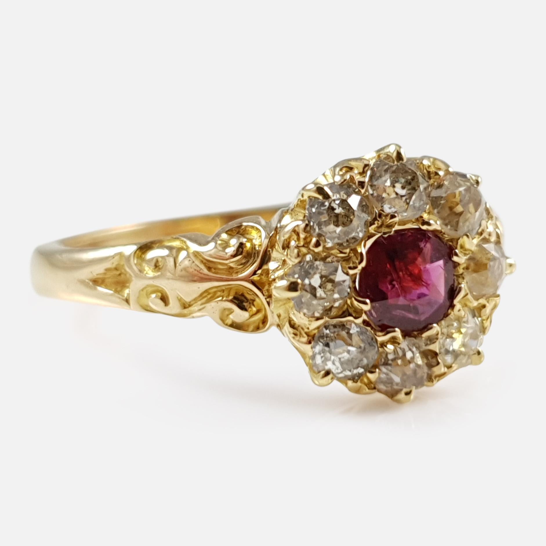 A stunning and extremely stylish Edwardian period 18 karat yellow gold ruby & diamond cluster ring - circa 1905. The ring is set with a central ruby weighing approximately 0.23cts, surrounded by a further eight old cut diamonds in a cluster