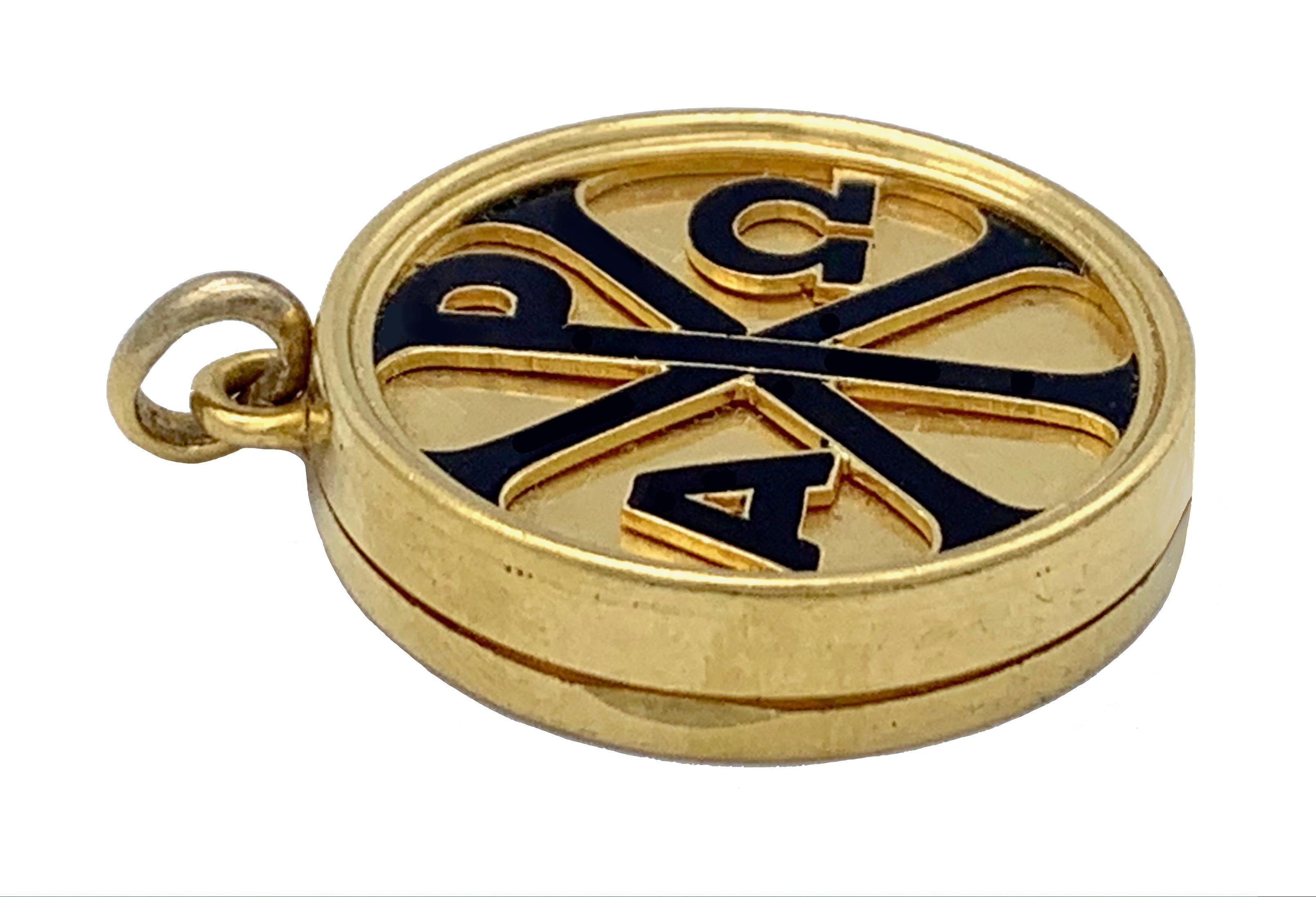 The front of this rare locket has a christogram and the greek letters Alpha and Omega carved in relief and highlighted with black enamel. The locket has a bible verse inscribed on the reverse.  
The inscription is written in german and is a verse