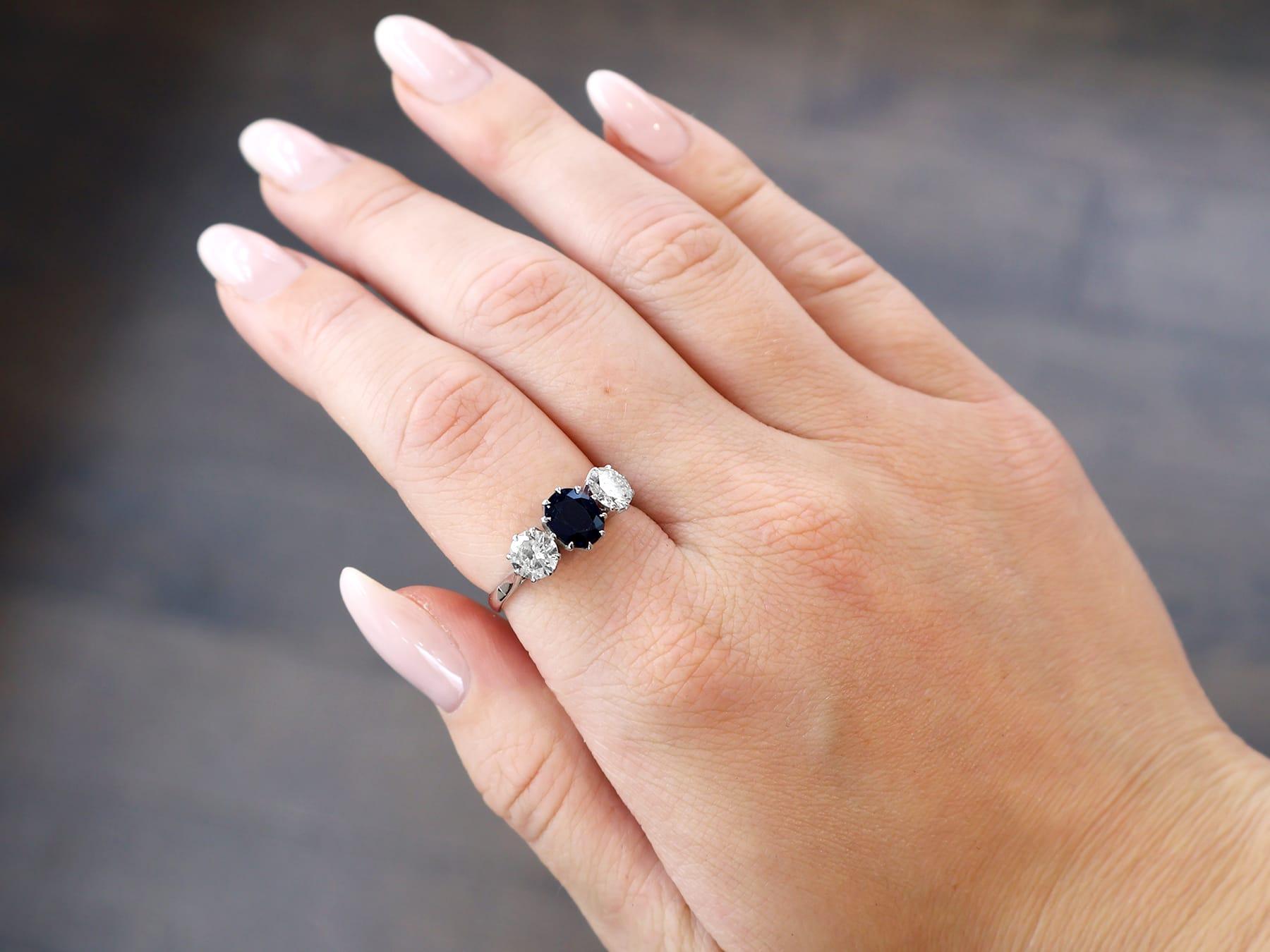 Oval Cut Antique 1.80 Carat Basaltic Sapphire 1.35 Carat Diamond White Gold Trilogy Ring For Sale
