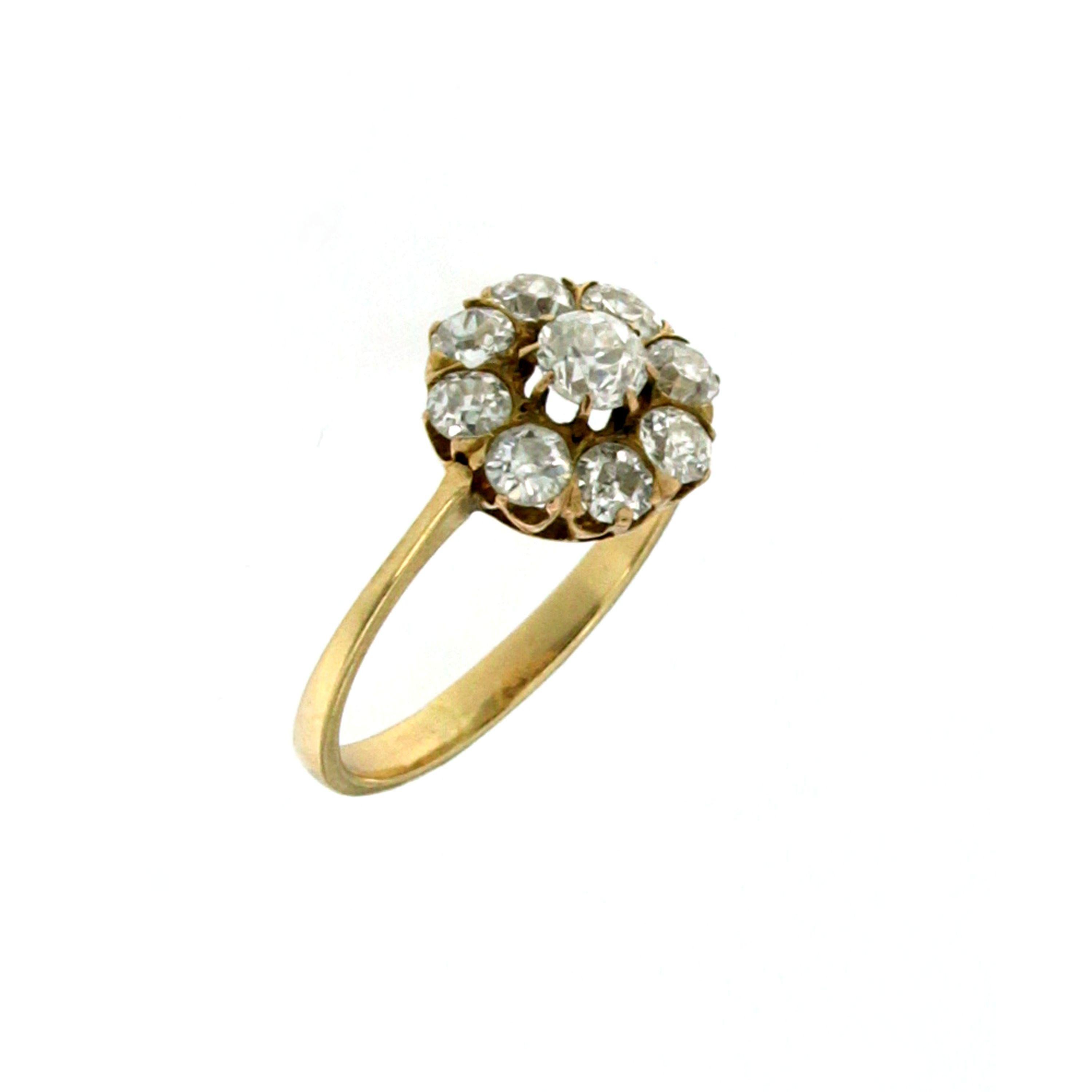 Beautiful 18K  Gold cluster ring set in the center with an Old Mine cut Diamond weighing 0.50 ct graded H color with Vs clarity and surrounded by eight round old mine cut Diamonds weighing all together 1.30 carats, graded H color Vs to Si