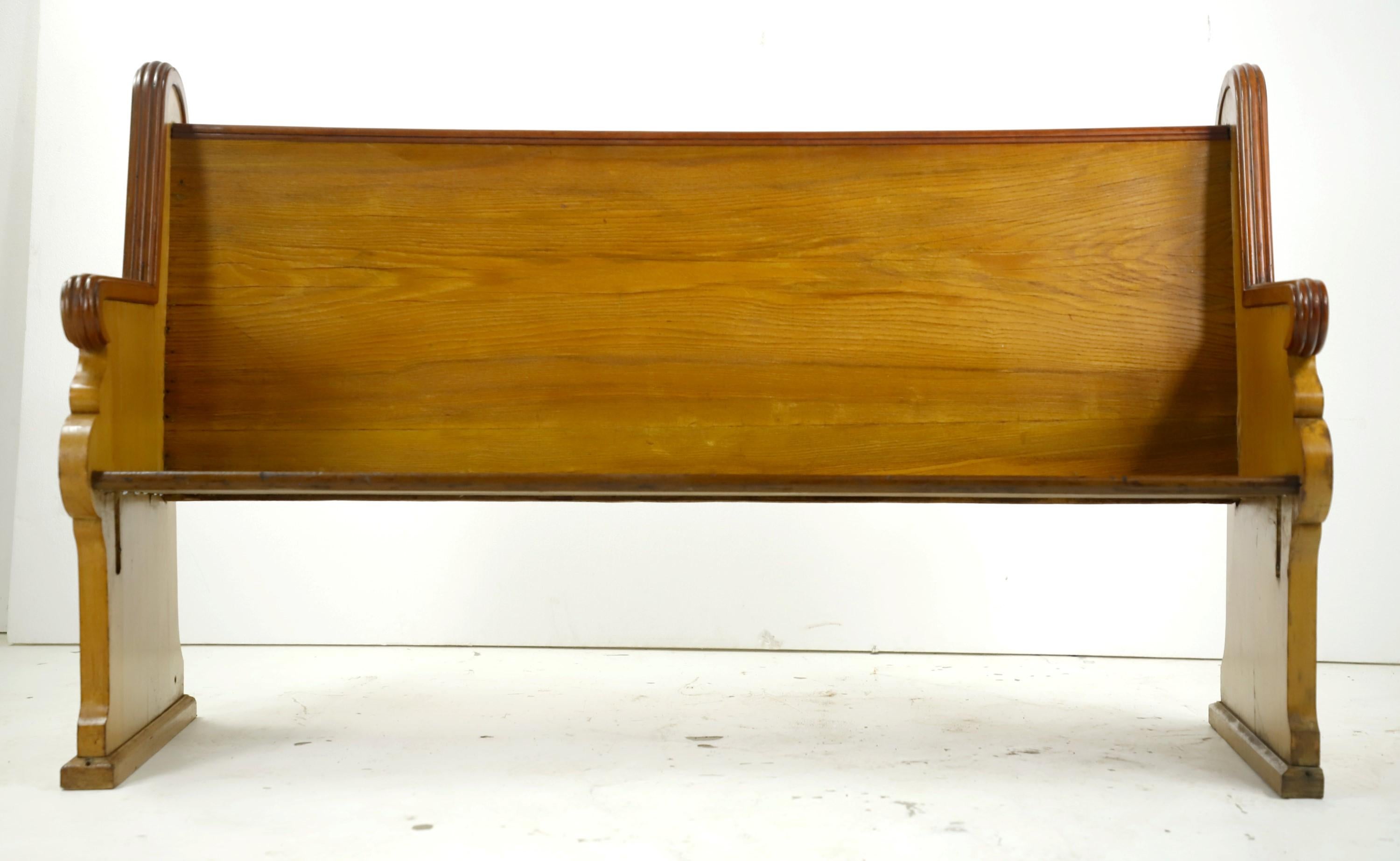 Late 1800s solid oak pew from a church. Geometric hand carved designs in the sides. Round bullseyes adorn the corners. Solid and comfortable. Please note, this item is located in our Scranton, PA location.