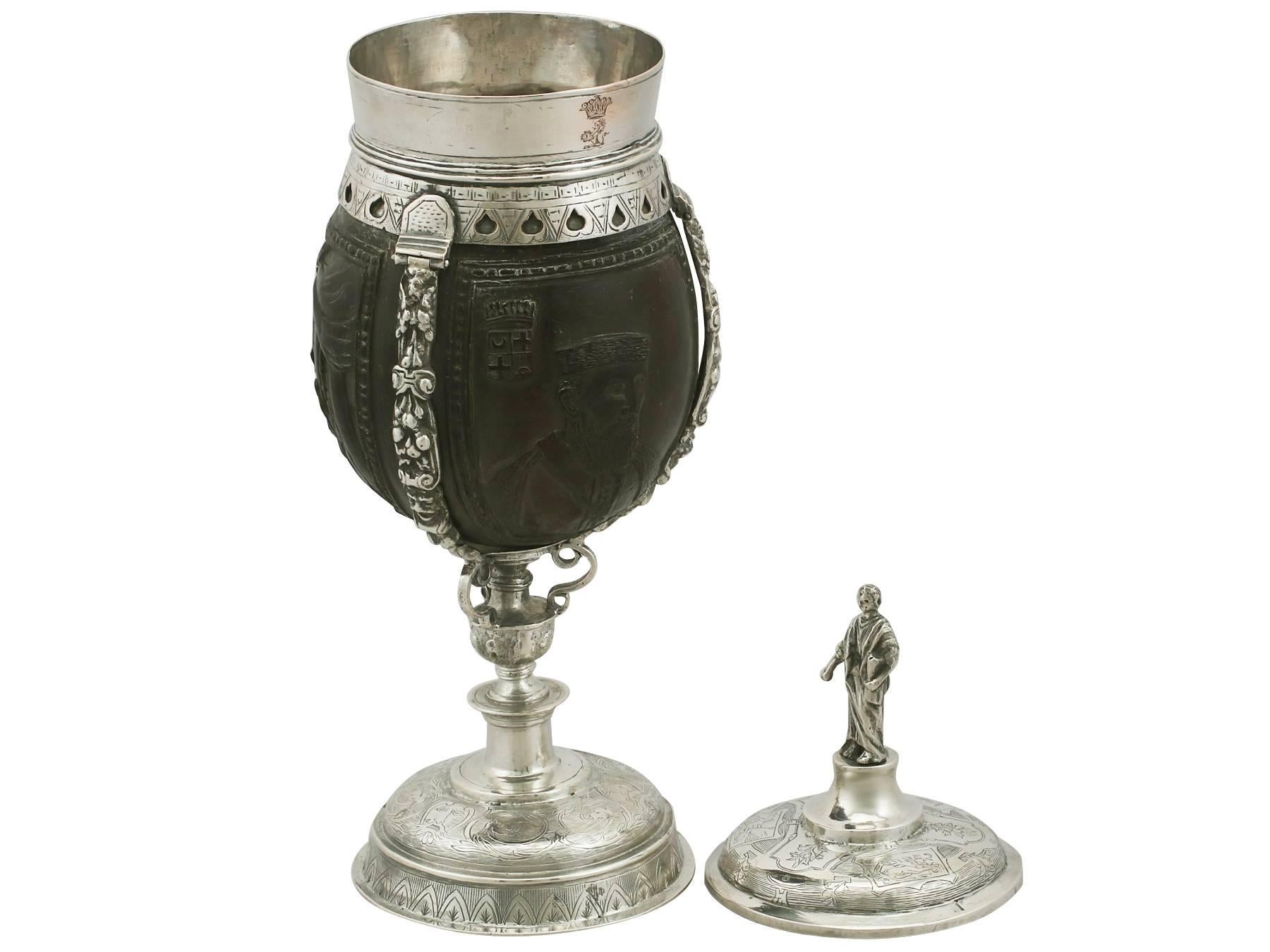An exceptional, fine and impressive antique continental silver mounted coconut cup; an addition to our diverse ornamental silverware collection

This exceptional antique silver cup has a flared rim and shaped pedestal onto a circular domed