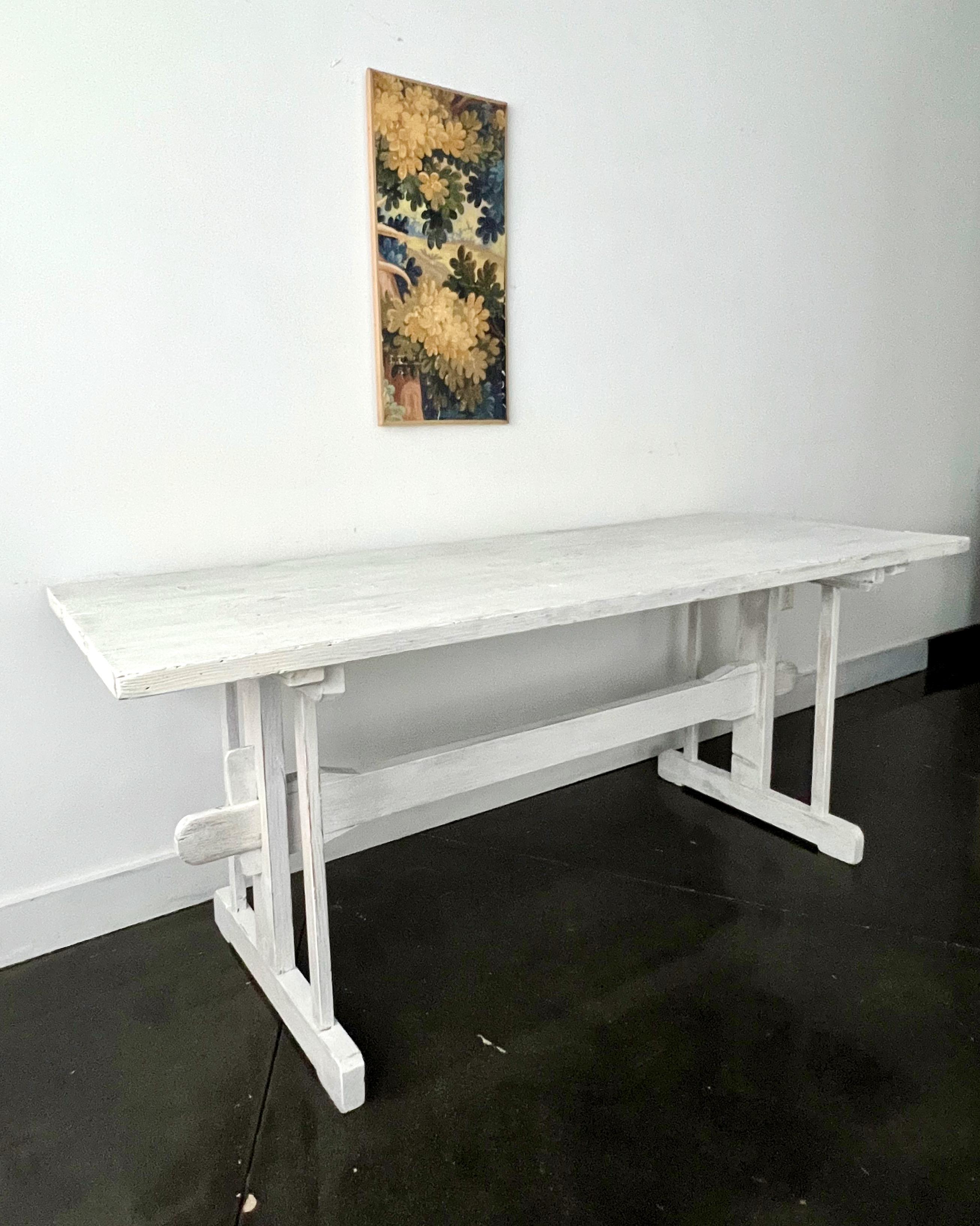  Antique rustic family table with thick natural pine blanks top on square splat ends held by stretcher with keyed through-tenons. White-washed later.
Very sturdy - the table comes apart for easy moving.
France , 1800's
\
