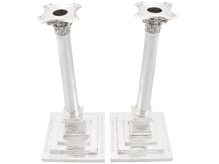 A magnificent, exceptional, fine and impressive, pair of large antique Georgian English sterling silver architectural column candlesticks; part of our ornamental silverware collection.

These magnificent antique Georgian English sterling silver
