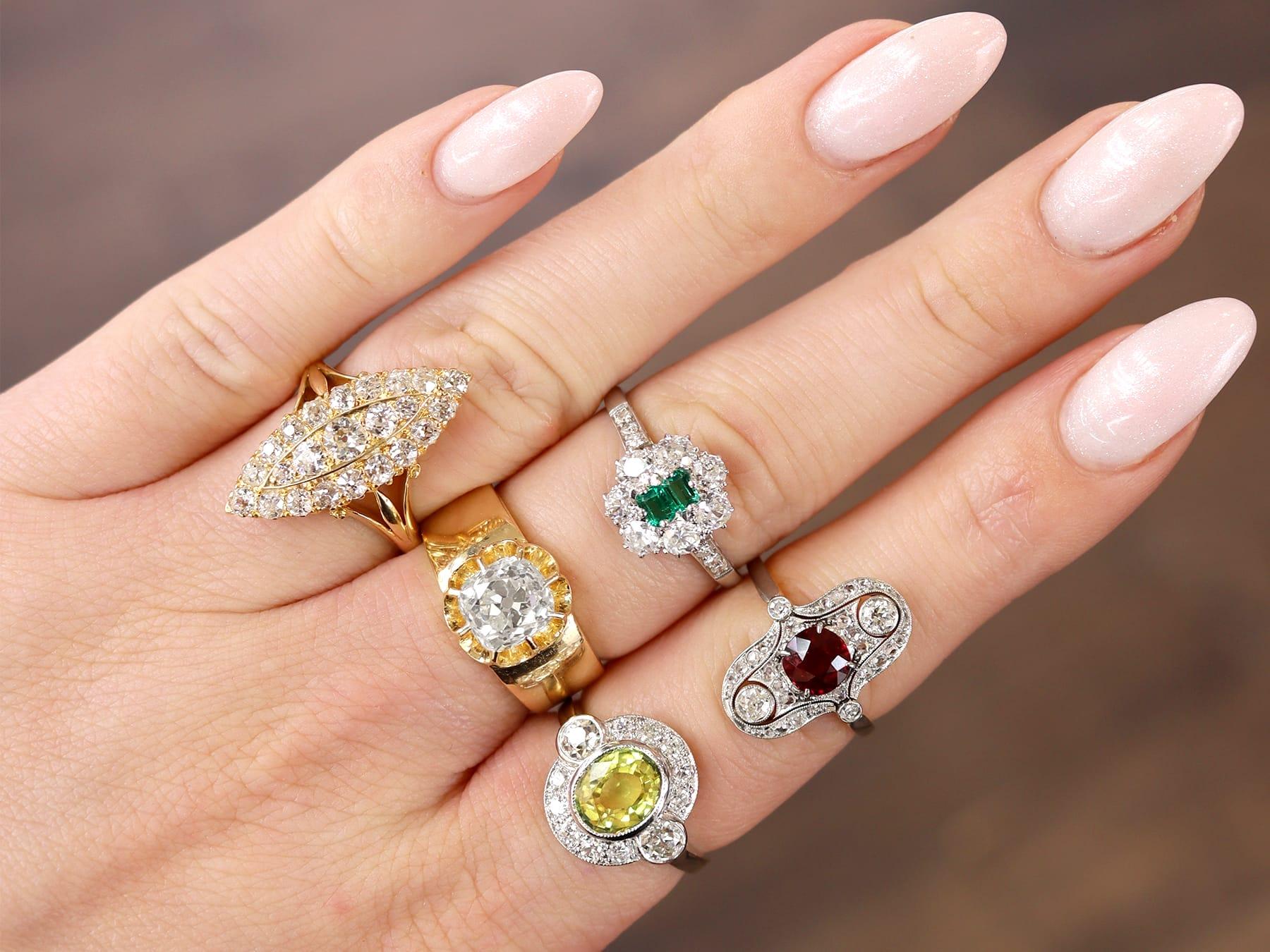A stunning, fine and impressive antique 1.80 carat green/yellow sapphire and 0.88 carat diamond, platinum ring; part of our diverse range of yellow sapphire rings.

This stunning, fine and impressive green-yellow sapphire ring has been crafted in