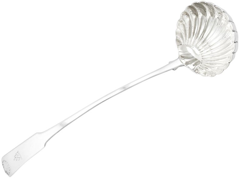 An exceptional, fine and impressive large antique George III Scottish sterling silver Fiddle & Shell pattern soup ladle, an addition to our silver cutlery collection.

This exceptional and large George III sterling silver soup ladle has been