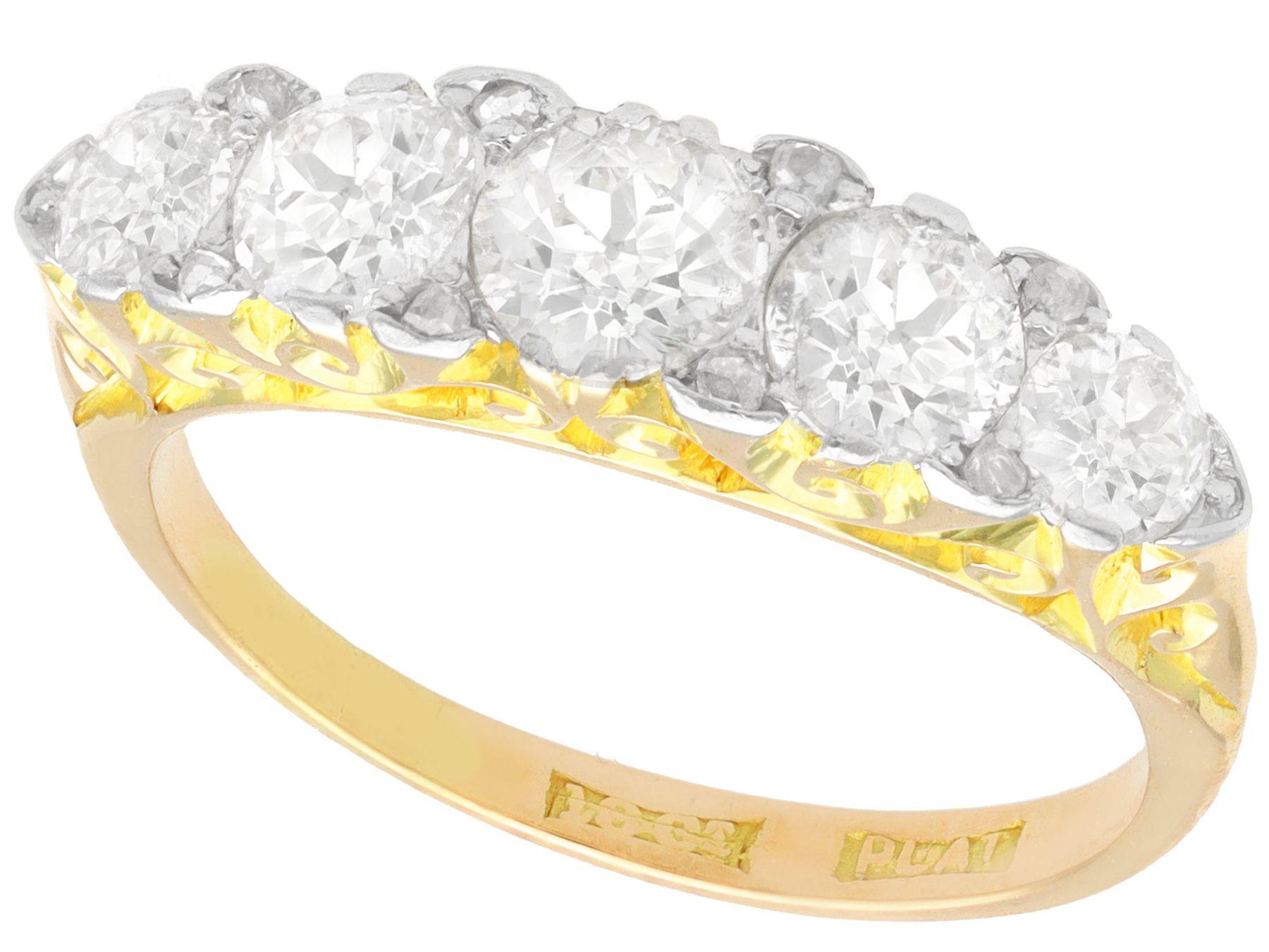 A stunning, fine and impressive 1.83 carat diamond, 18 karat yellow gold and platinum five stone ring; part of our diverse antique jewelry and estate jewelry collections

This fine and impressive gold five stone diamond ring has been crafted in 18k